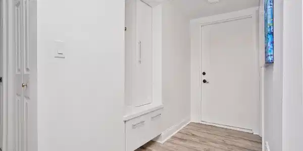 Image 4: Entrance way with custom cabinet/cubby for added storage1