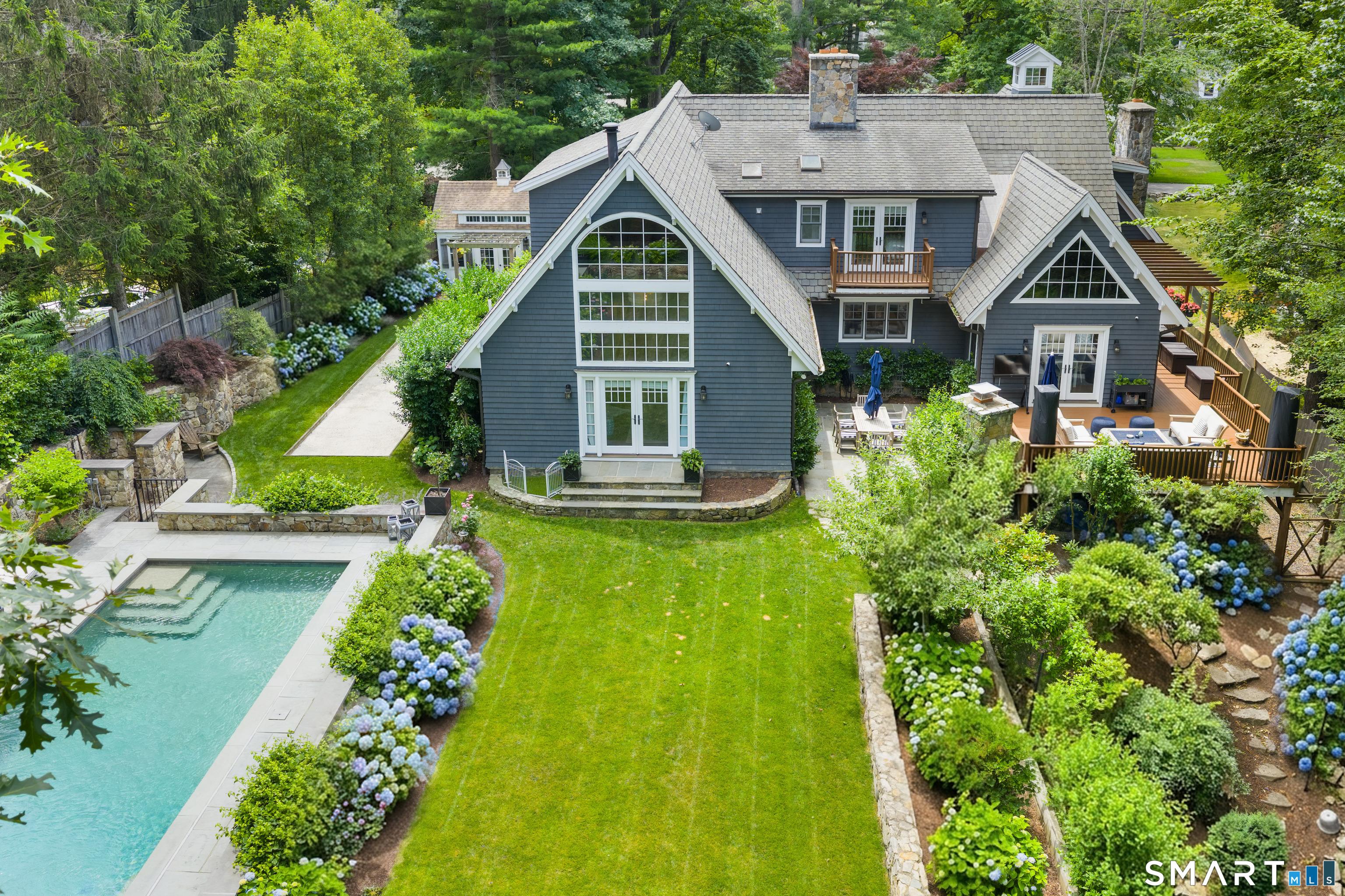 Image 2Back of House: Your own private resort: Beautifully landscaped flat yard, pool, patio, outdoor kitchen, Bocce court and Pool house