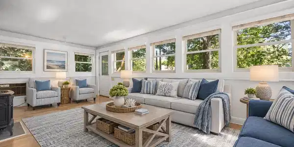 Image 4Living Room: Tons of natural lighting and a gas stove for those chillier nights! 