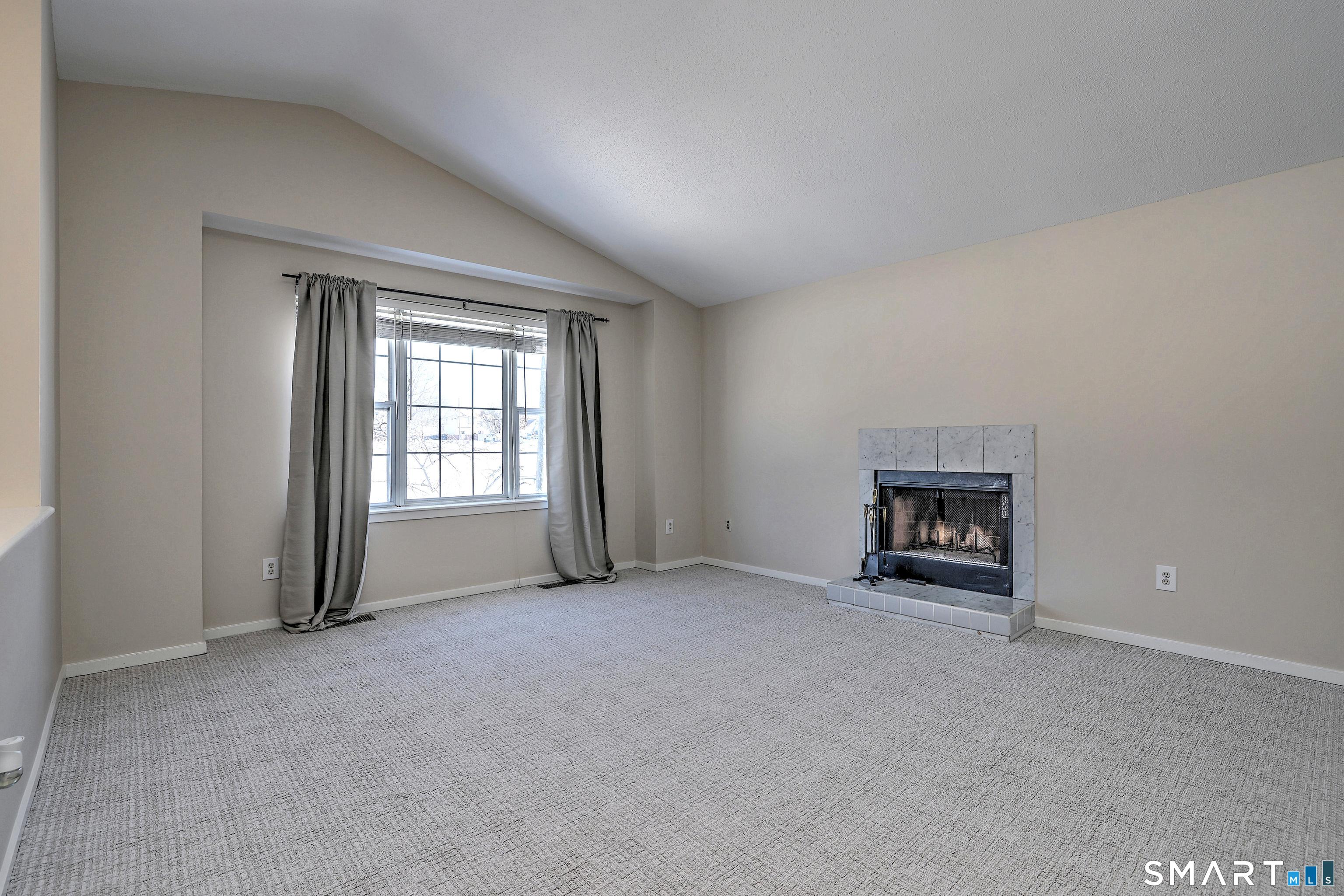 Image 4: Living Room with Wood Burning Fireplace and new wall to wall carpet