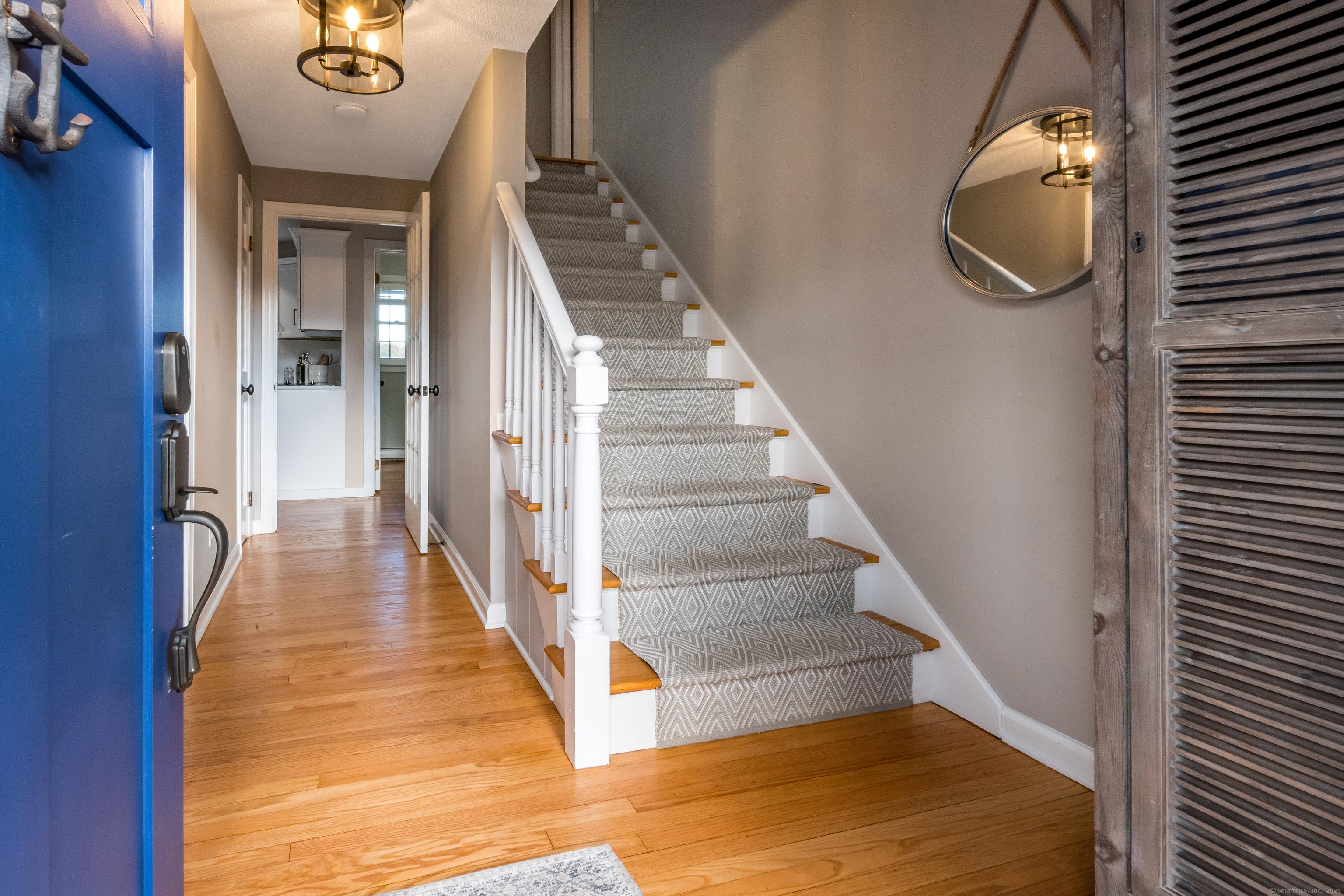 Image 3Entrance Foyer: Welcome home to a foyer that effortlessly guides you with the family room to the left and the staircase ahead leading to peaceful second floor retreats