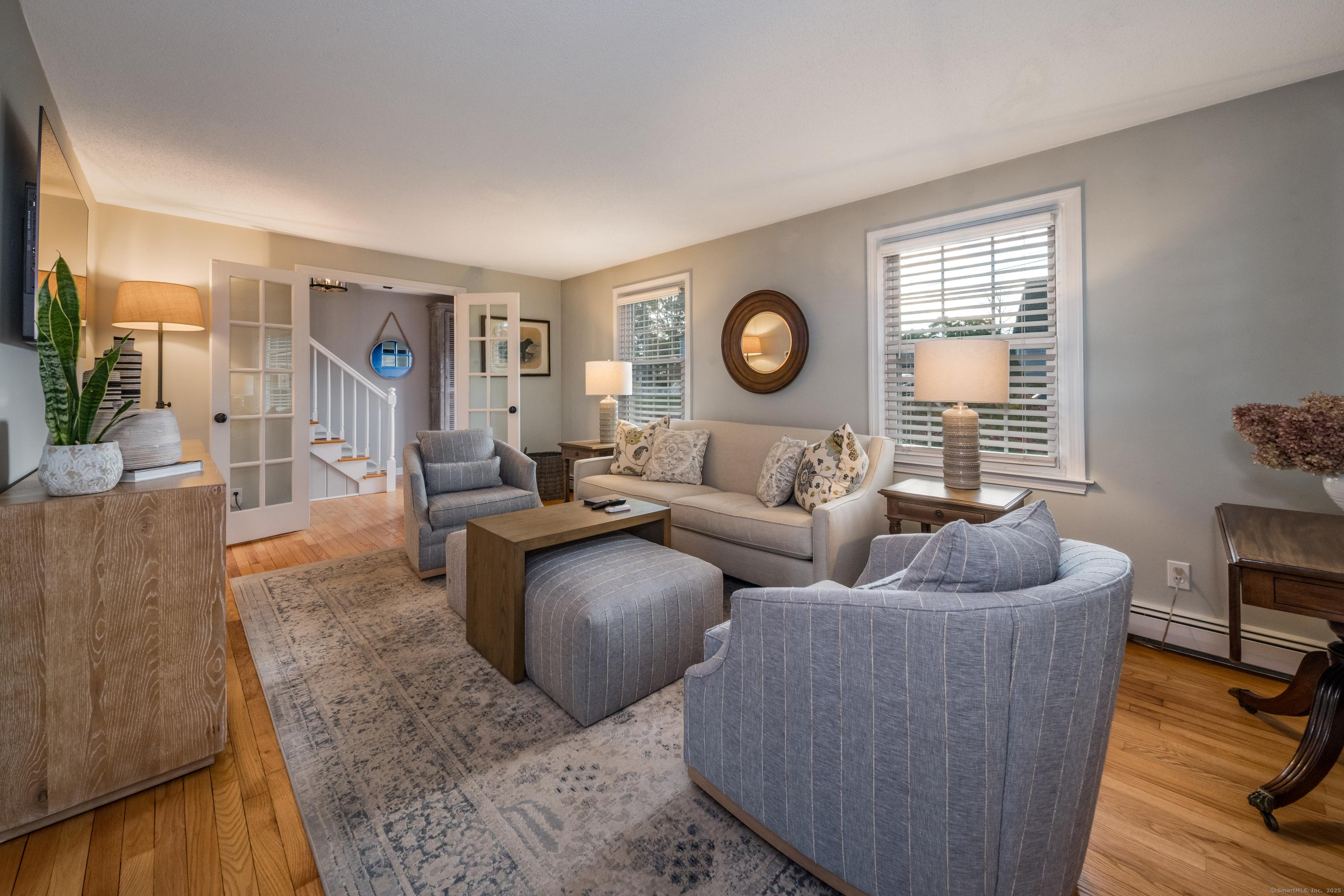 Image 4Living Room: French doors open to a comfortable living room space