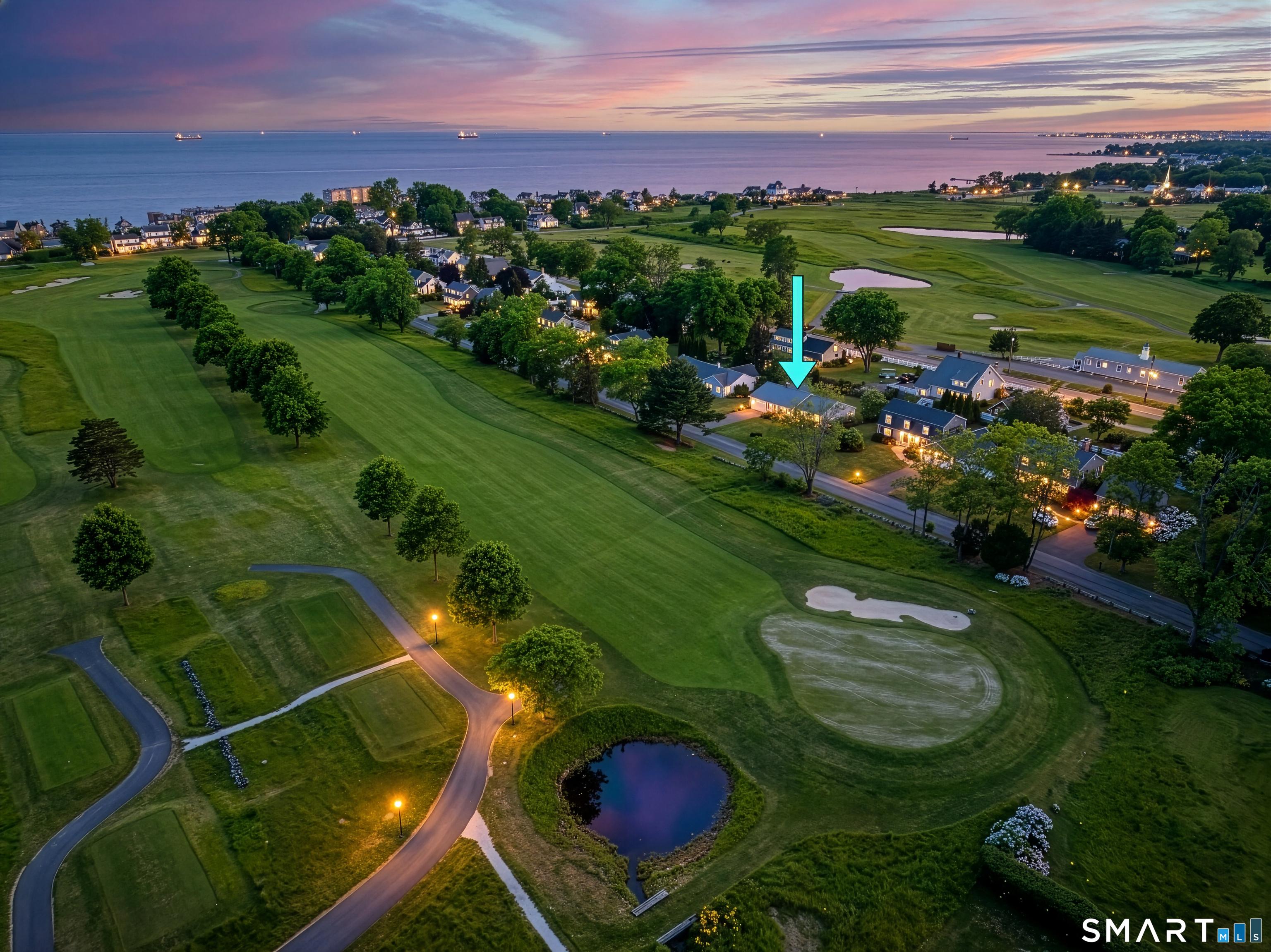 Image 2: Twilight aerial photos of home. Golf course on either side and walk to West Wharf beach