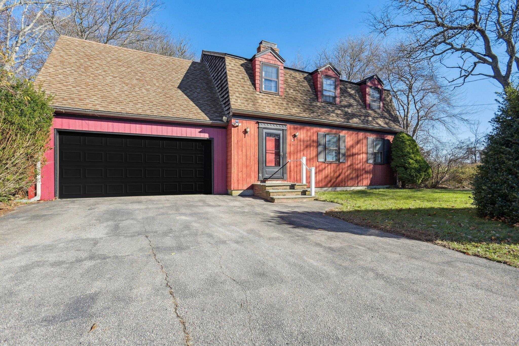 Image 1: Black on garage door is virtually enhanced. Painted since photo was taken.