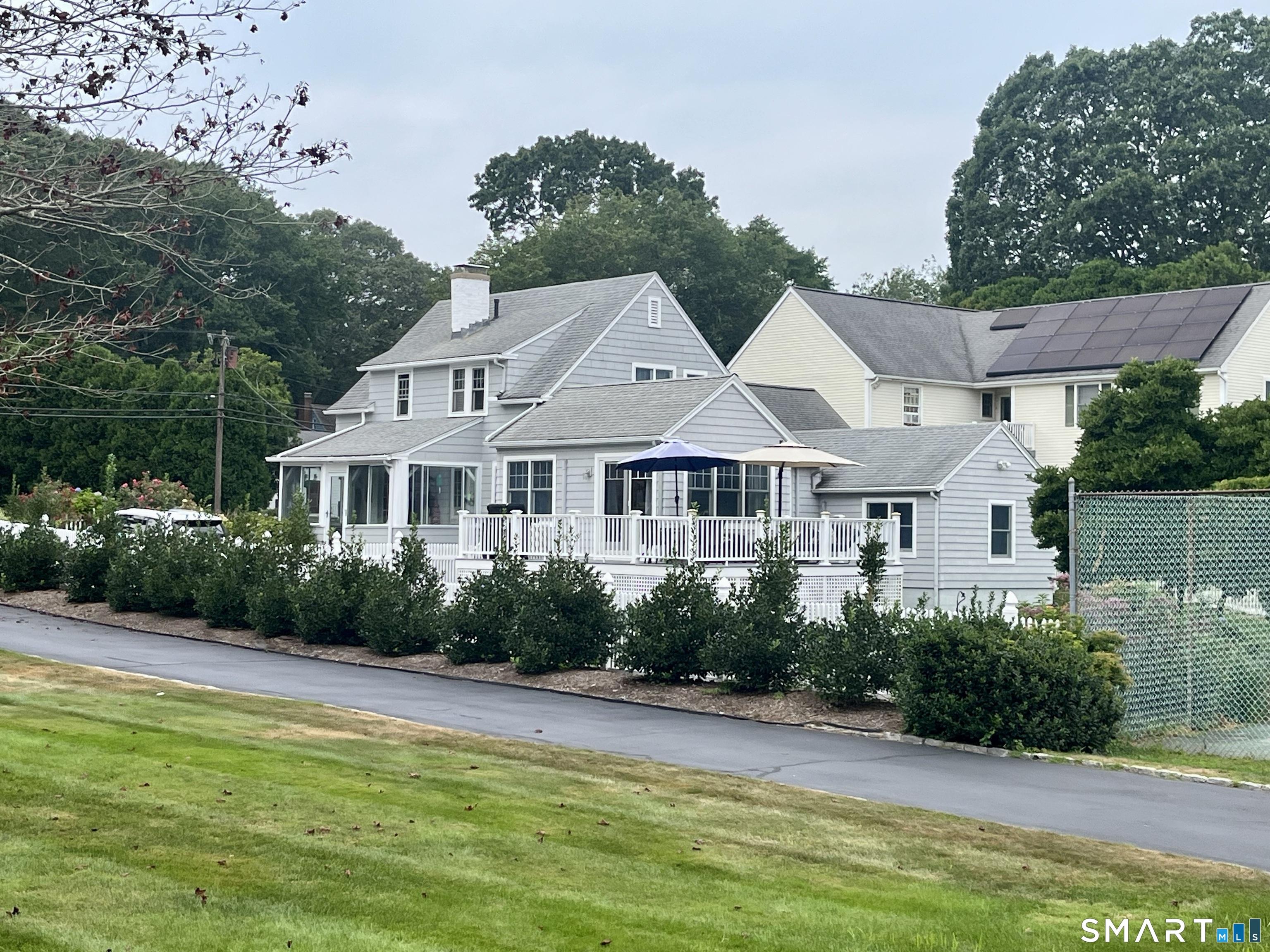Image 3Back of House: View of Side and Back of House with wraparound deck.