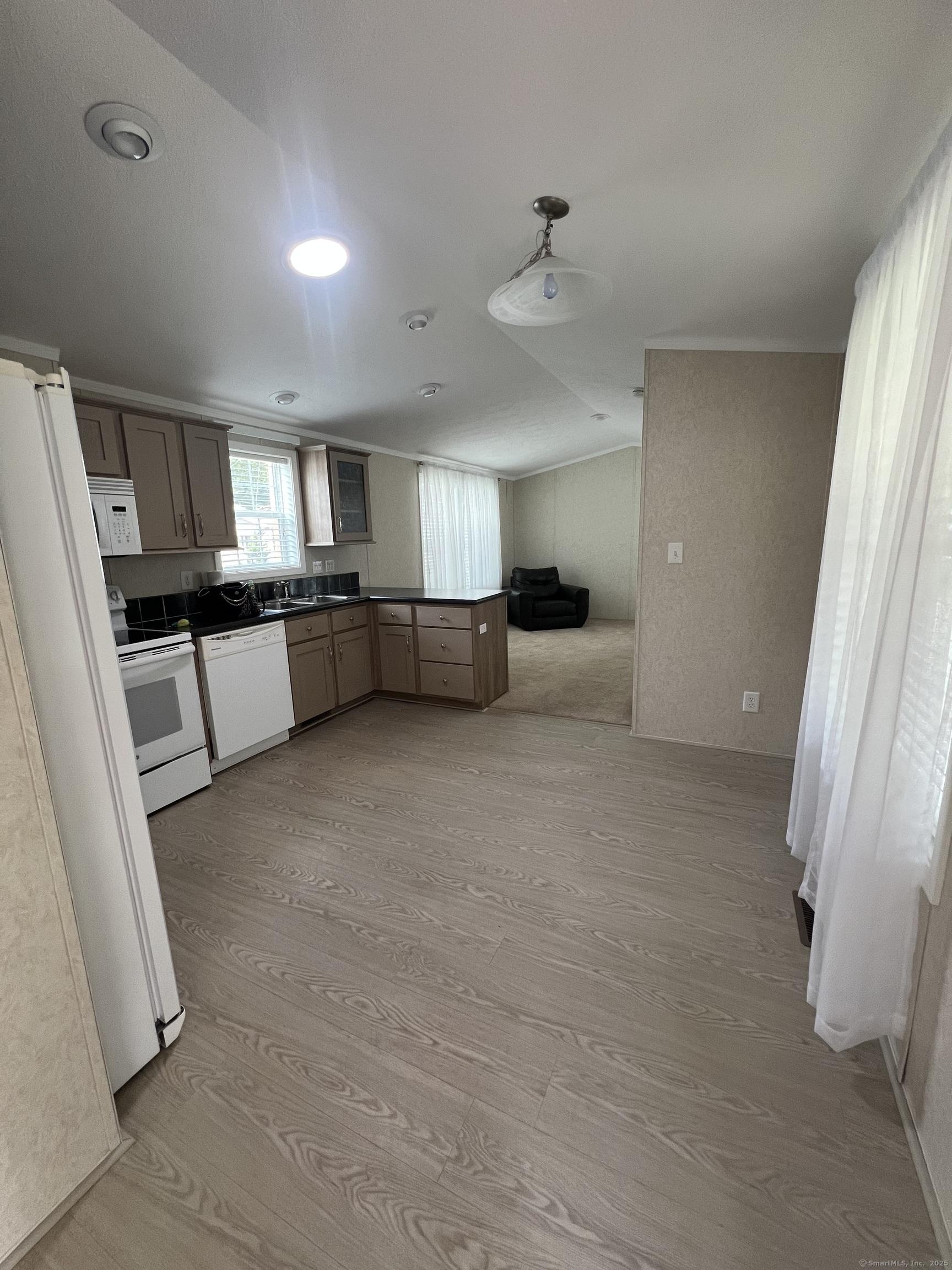 Image 3: Kitchen with eat in area.