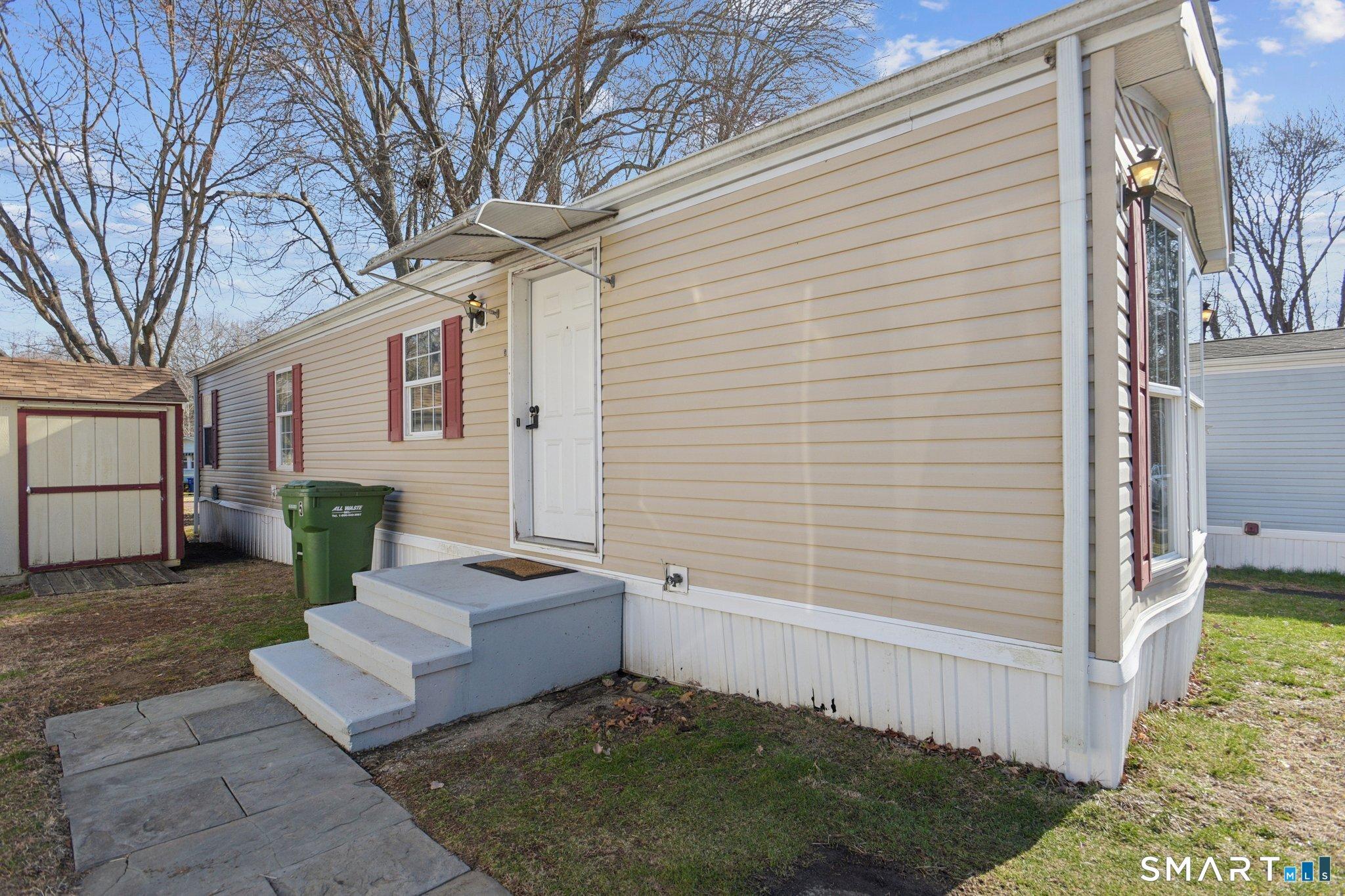 Image 3: Your entry. You have a parking spot directly next to the home, and a second spot at the end of Cook Terrace