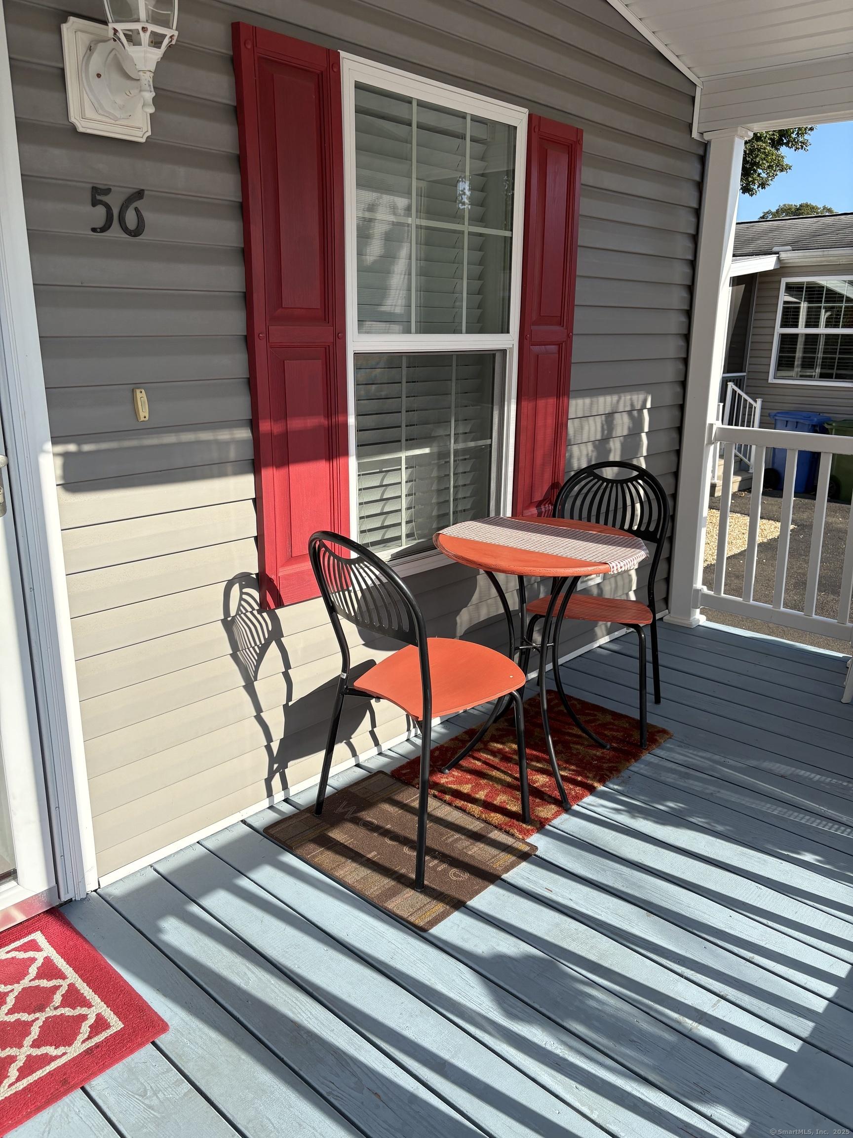 Image 4: Adorable front porch for just hanging out or visiting with neighbors.