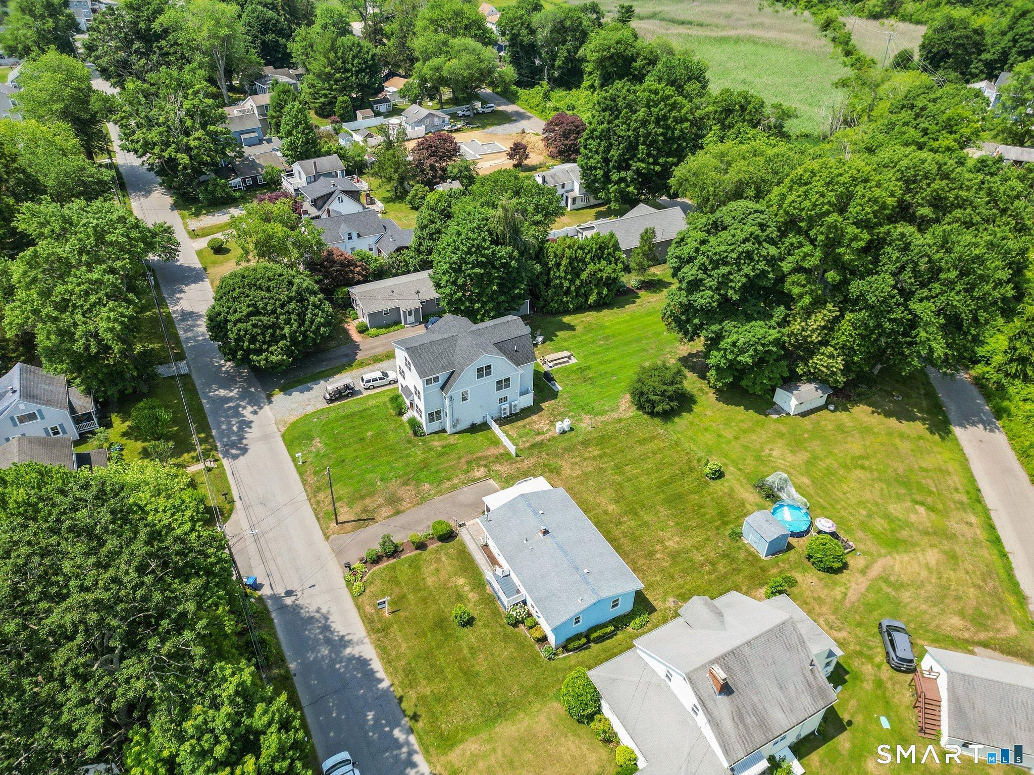 Image 2: View of yard. Prperty line ends at the shed.