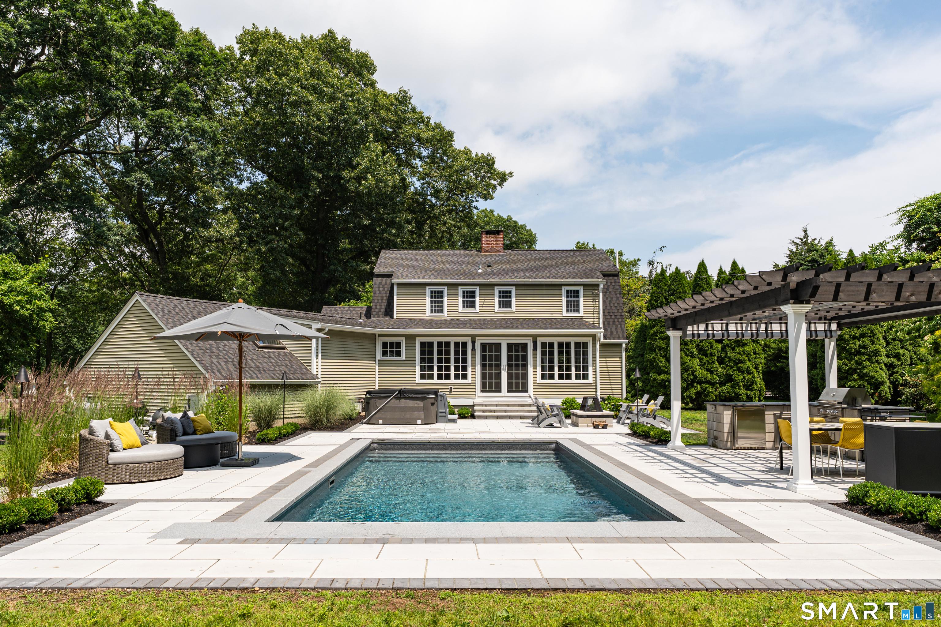 Image 3Swimming Pool: Spend every summer surrounded by luxury with a heated saltwater pool, granite coping, and an automatic pool cover for effortless enjoyment.