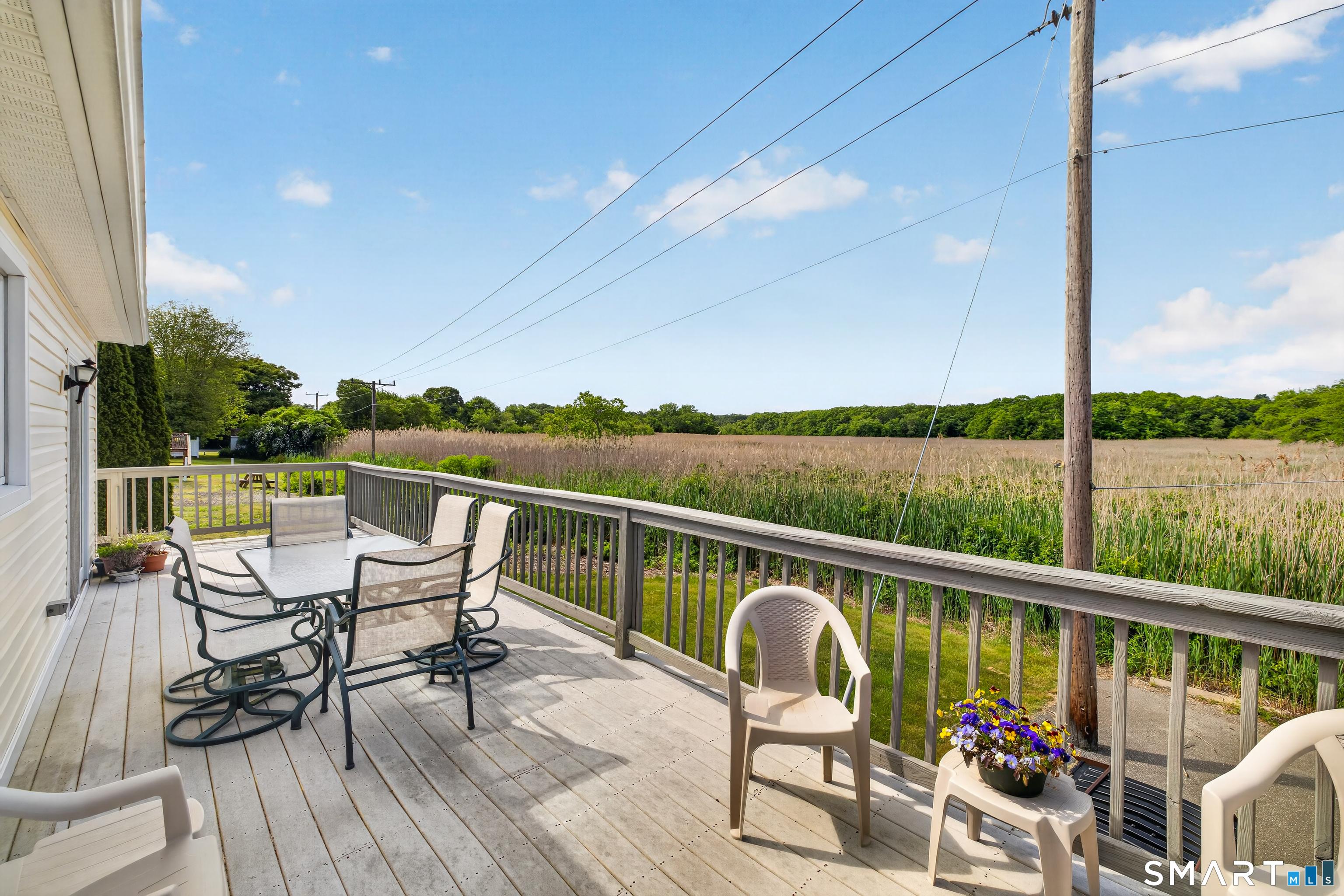 Image 4: Wrap-around deck over looking the marsh. Shoreline property.