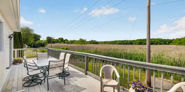 Image 4: Wrap-around deck over looking the marsh. Shoreline property.