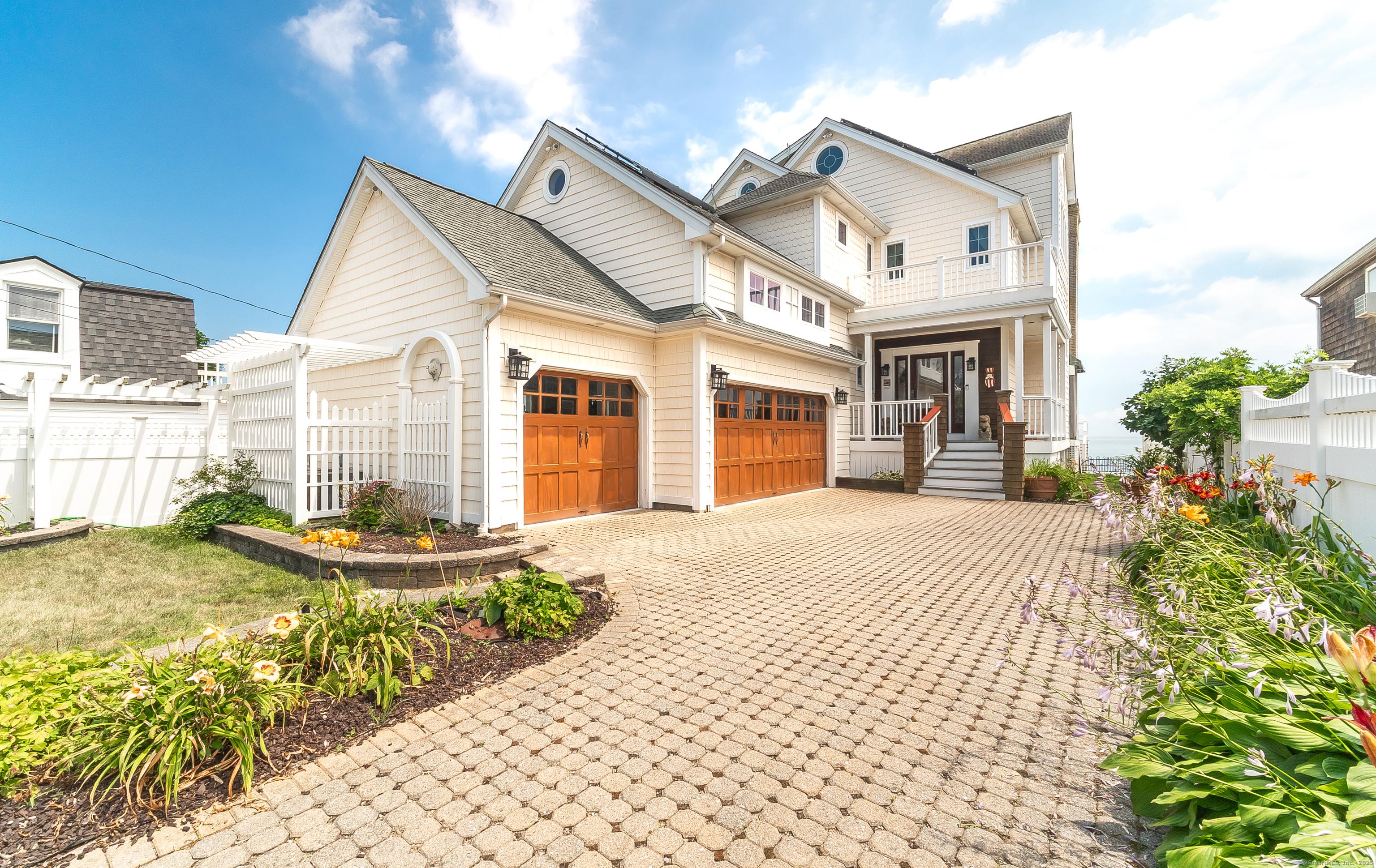 Image 2: 167 Shore Road entrance with a 3-car heated garage.