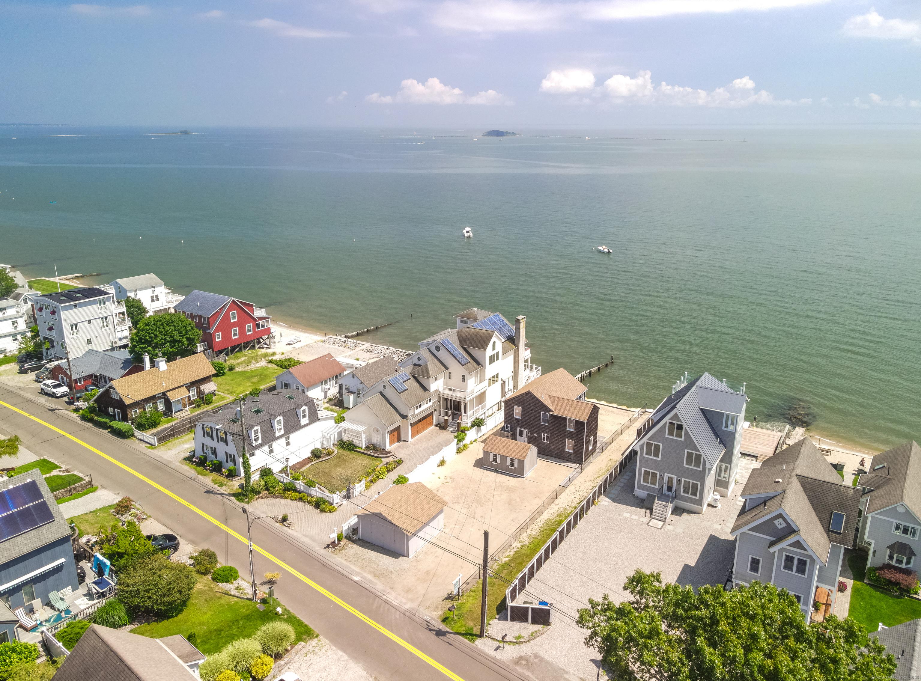 Image 3: Aerial view of 167 Shore Rd with plenty of space to park up to 6 cars in the driveway.