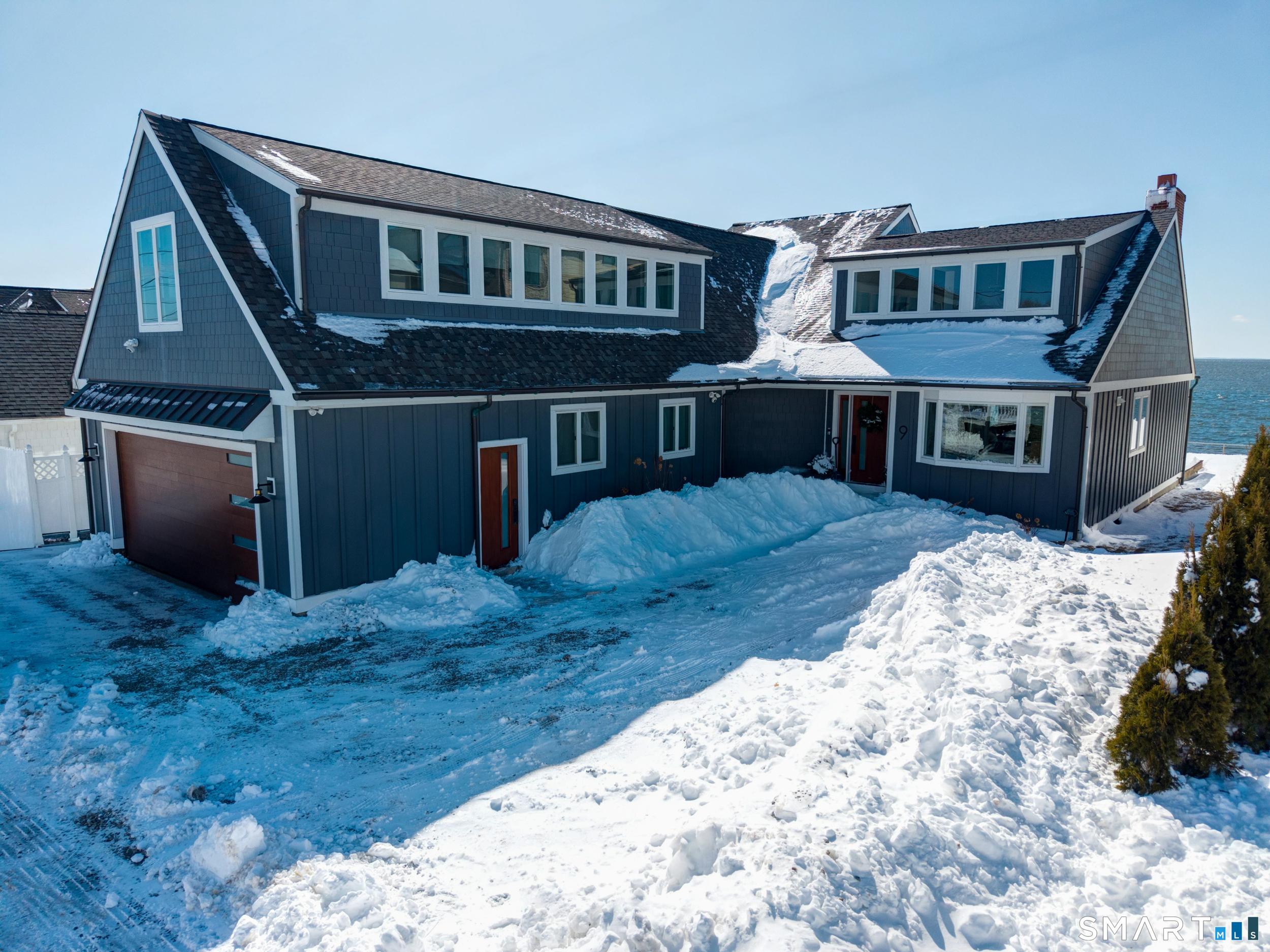 Image 1Front of House: 9 Loop Road in Clinton sits high above Long Island Sound along the Connecticut shoreline. FLOOD INSURANCE NOT REQUIRED!