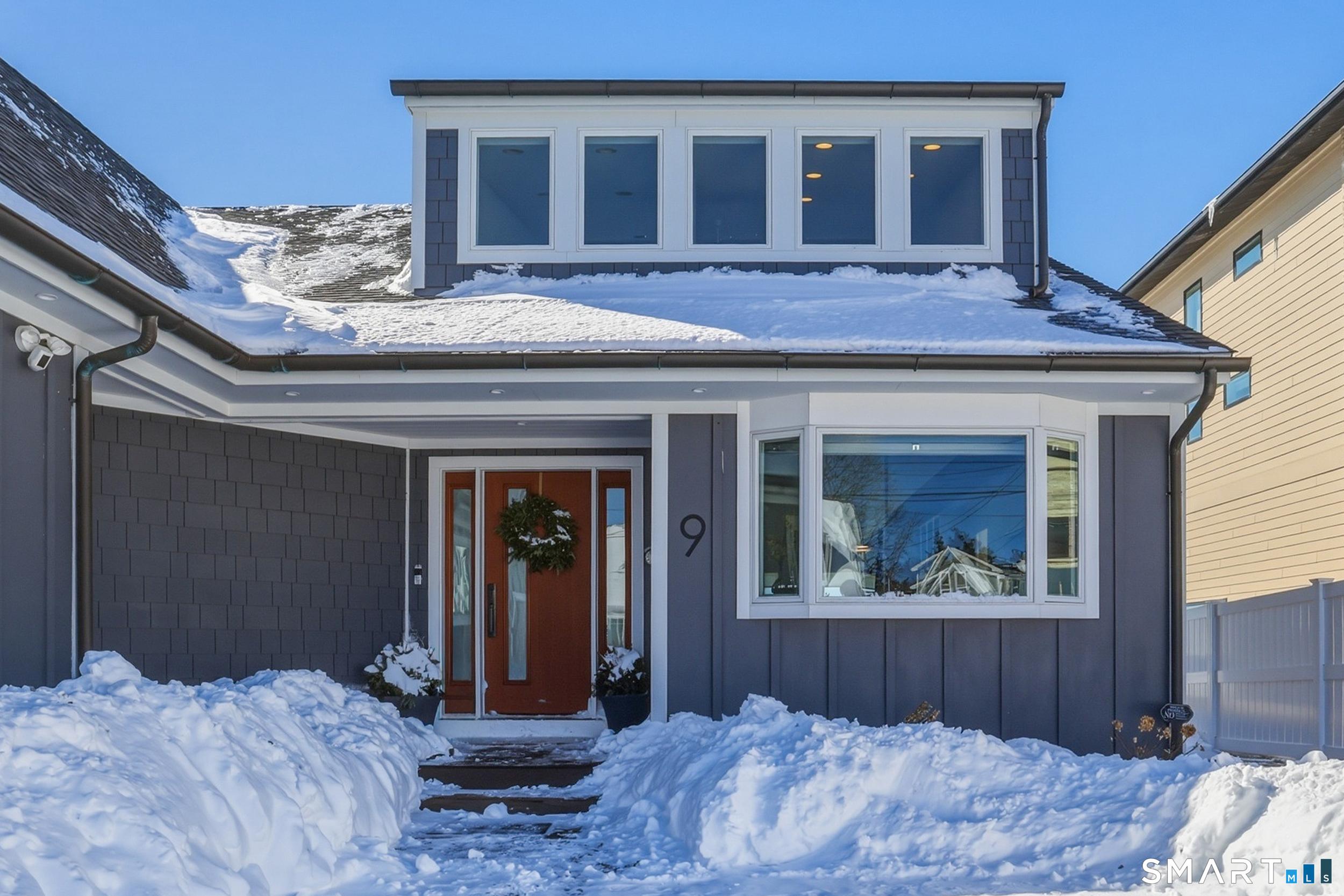 Image 3Front of Structure: WELCOME HOME... perfect for year round residence or waterfront escape. Gravel parking courtyard in front leads to slate walkway to covered front porch.