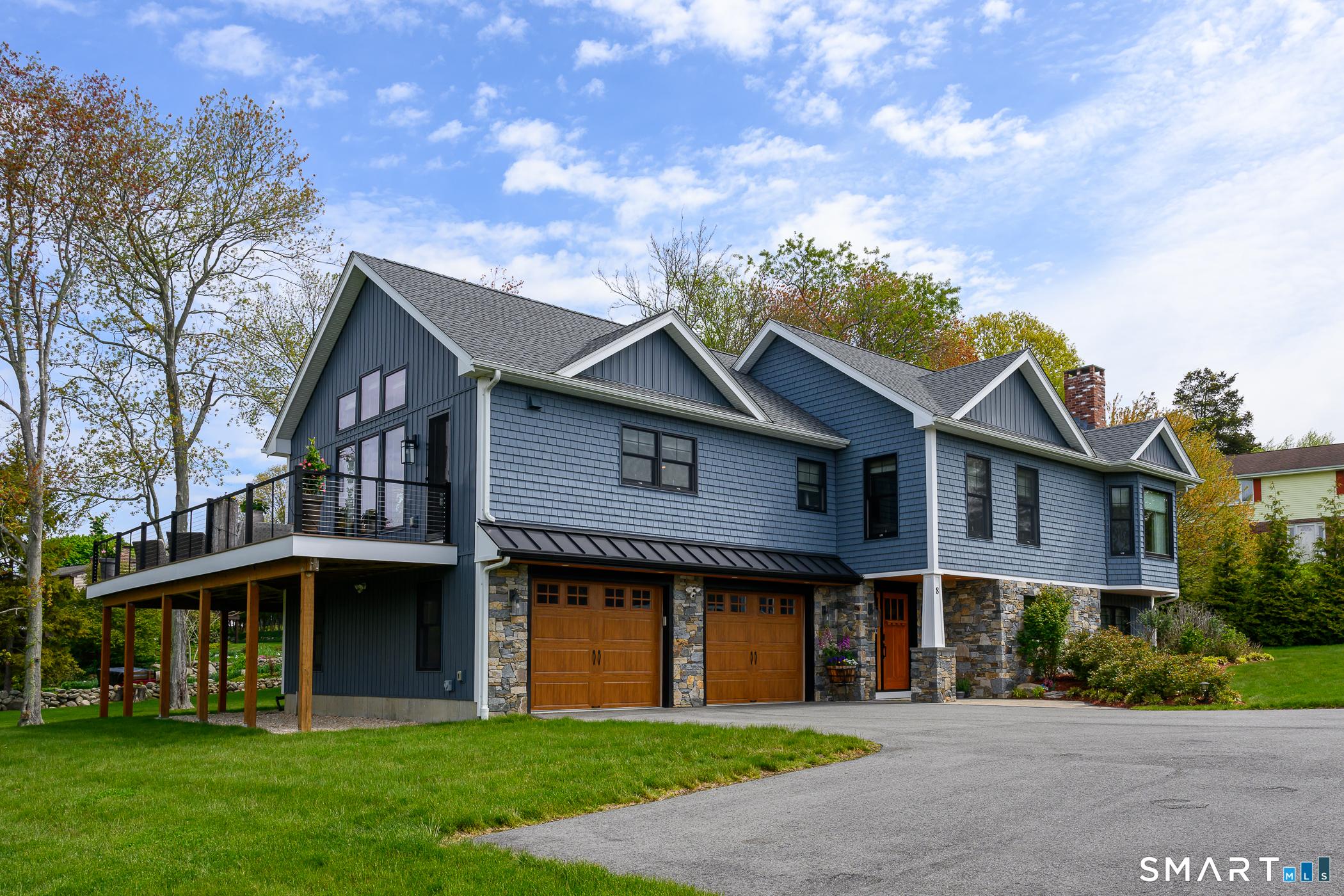 Image 1Front of House: Thoughtfully curated by a professional designer, welcome to this turnkey coastal residence