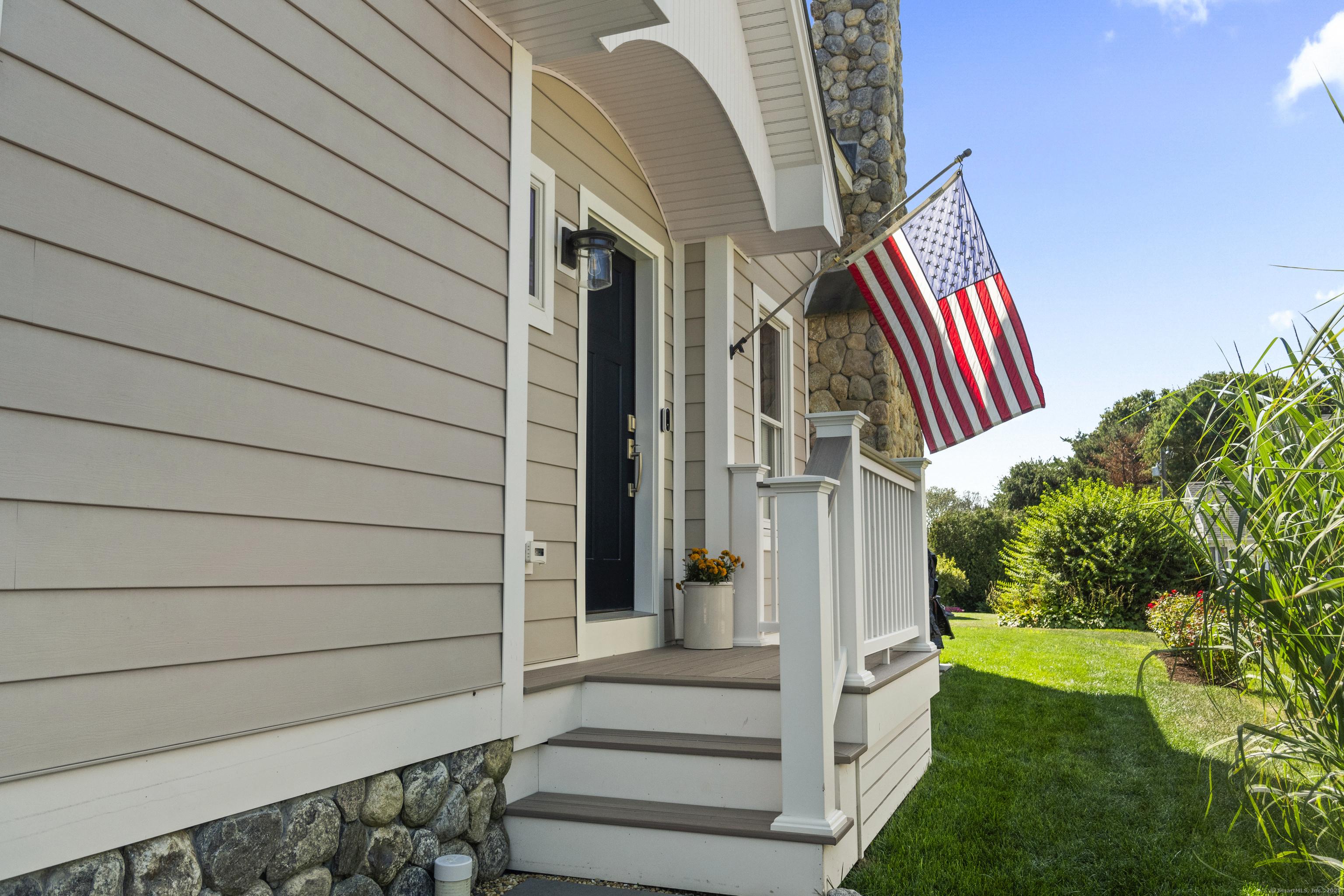 Image 4: One of several entrances to this pristine home