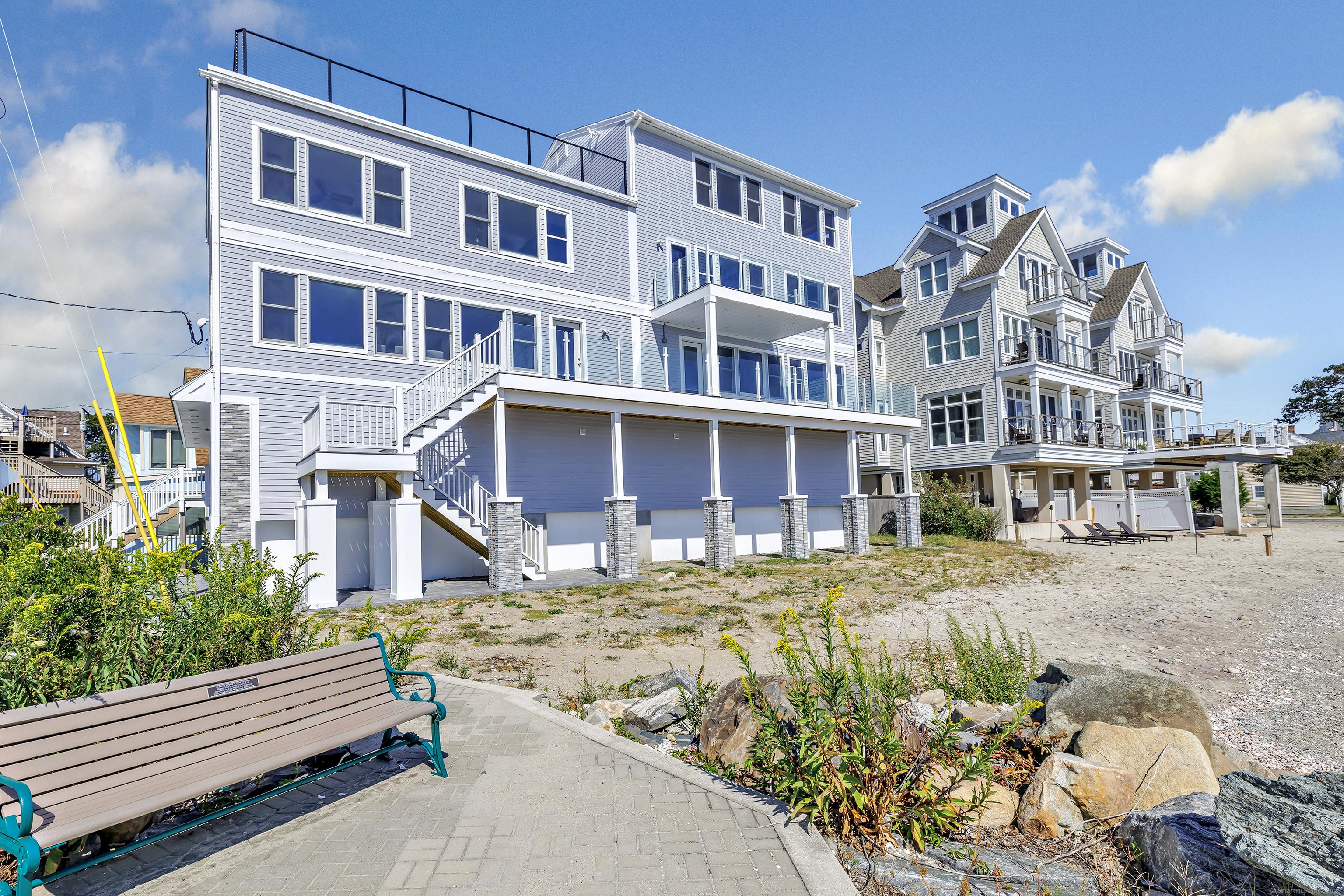 Image 2: The best of beachfront living in this spacious home with multiple expansive decks.