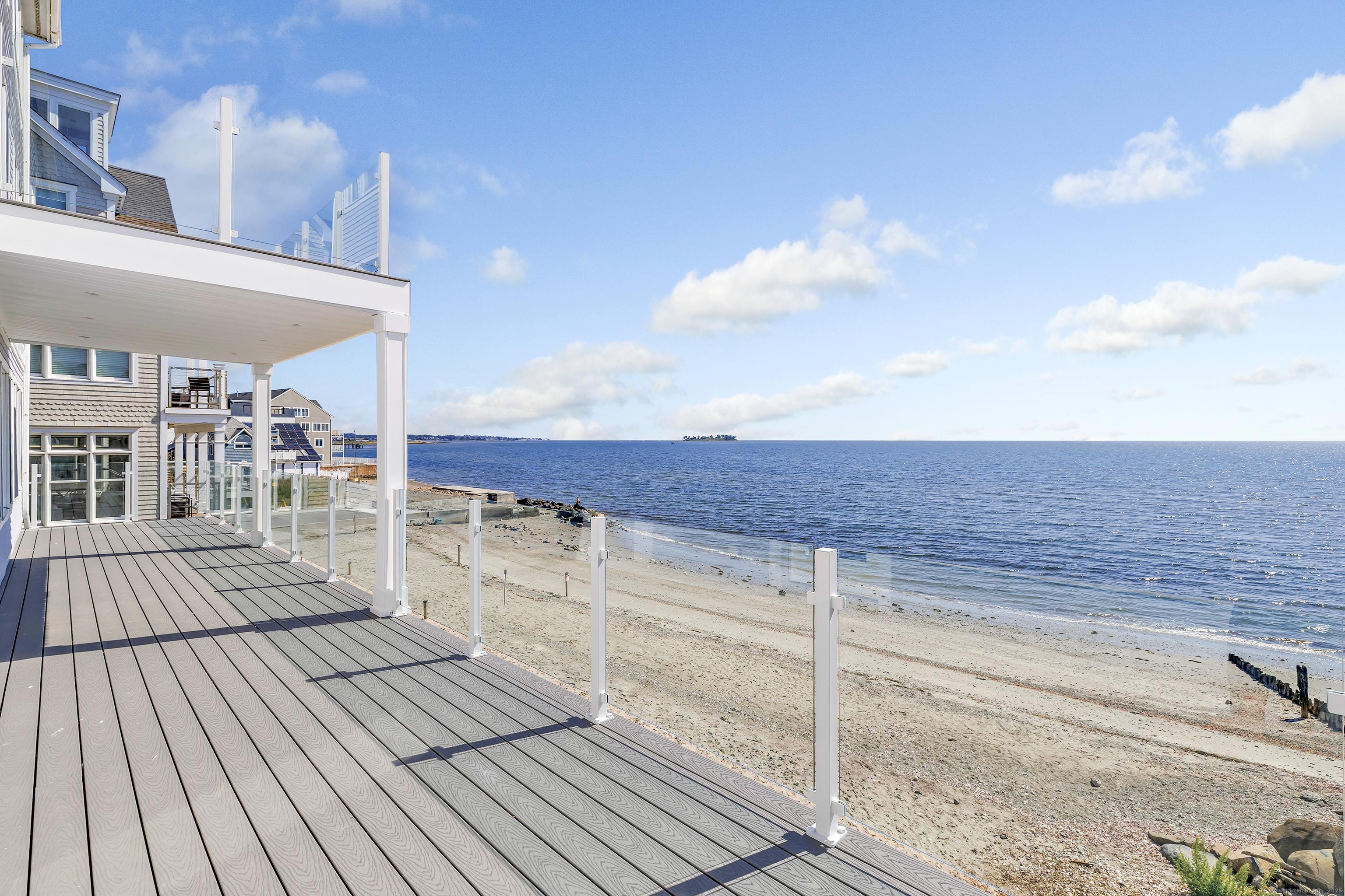 Image 3: Endless water views from the beachfront deck.