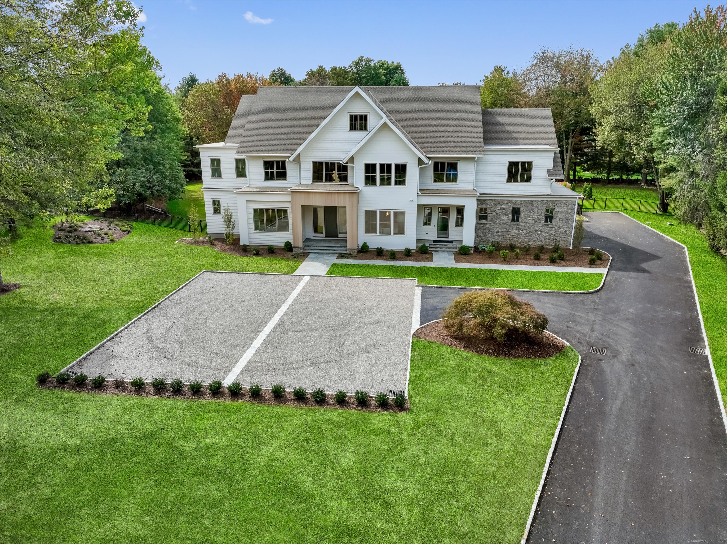 Image 2Aerial View: Graceful driveway approach to the home