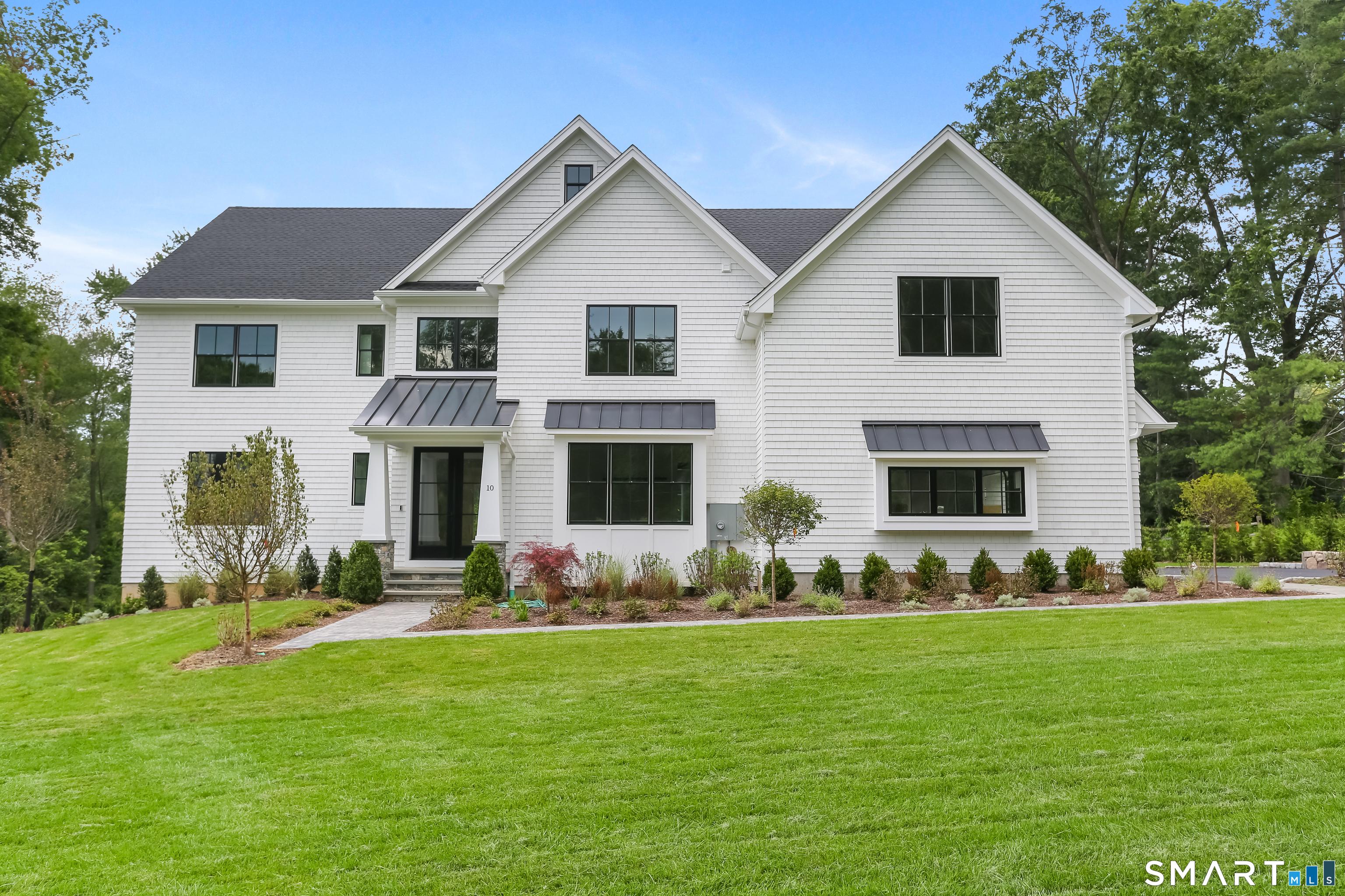 Image 1Front of House: This newly constructed home is located at the end of a private lane in the heart of the sought after Greens Farms area of Westport.