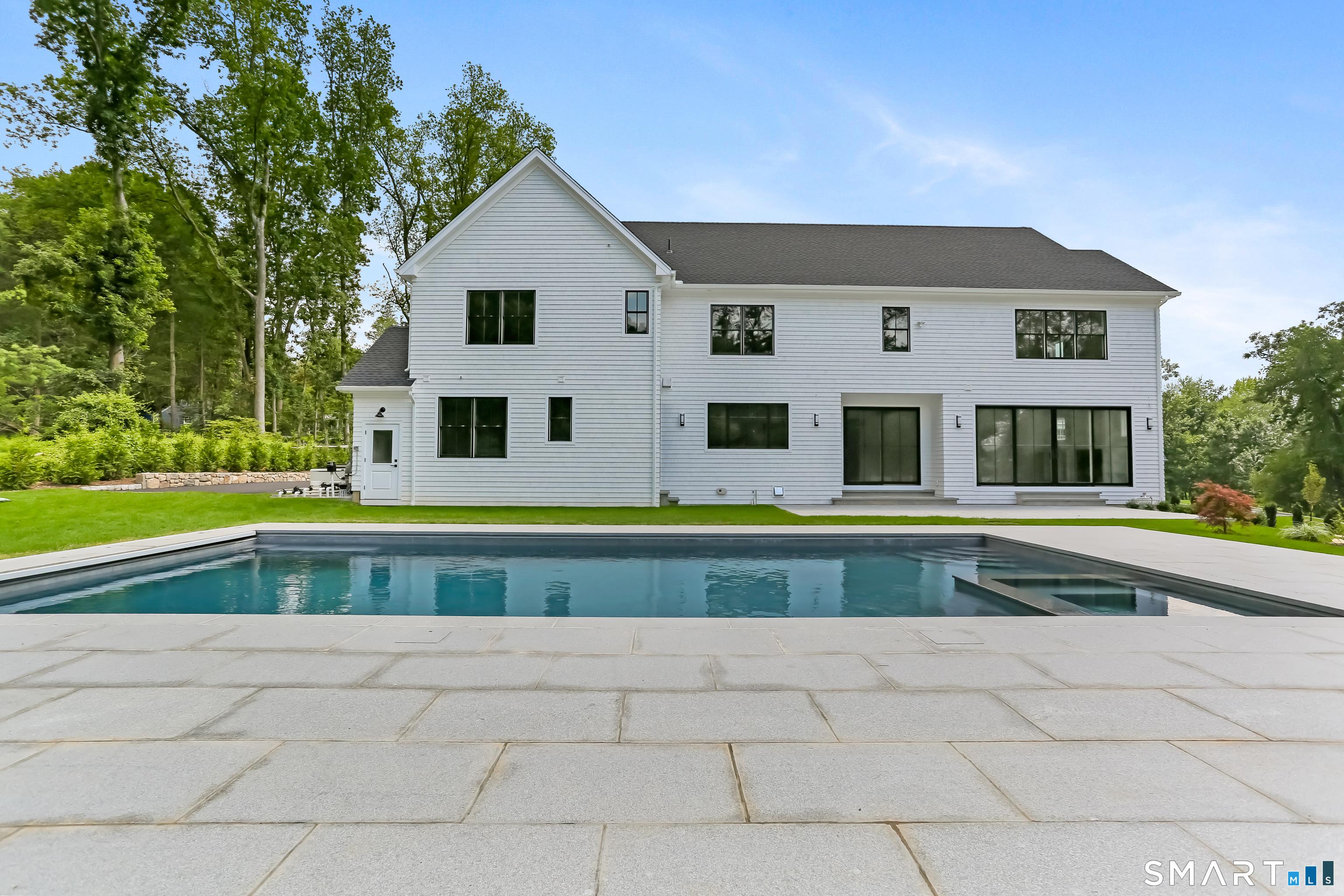 Image 2Swimming Pool and Spa: This salt water swimming pool with electronic cover is surrounded by a granite patio on 1.4 scenic acres.