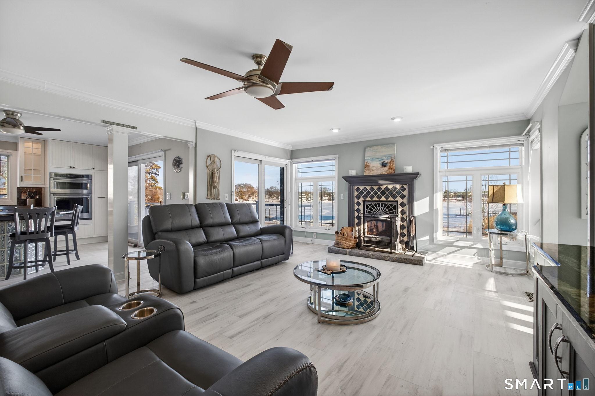 Image 4: Open Living Room and Dining Room with Panoramic Water Views.