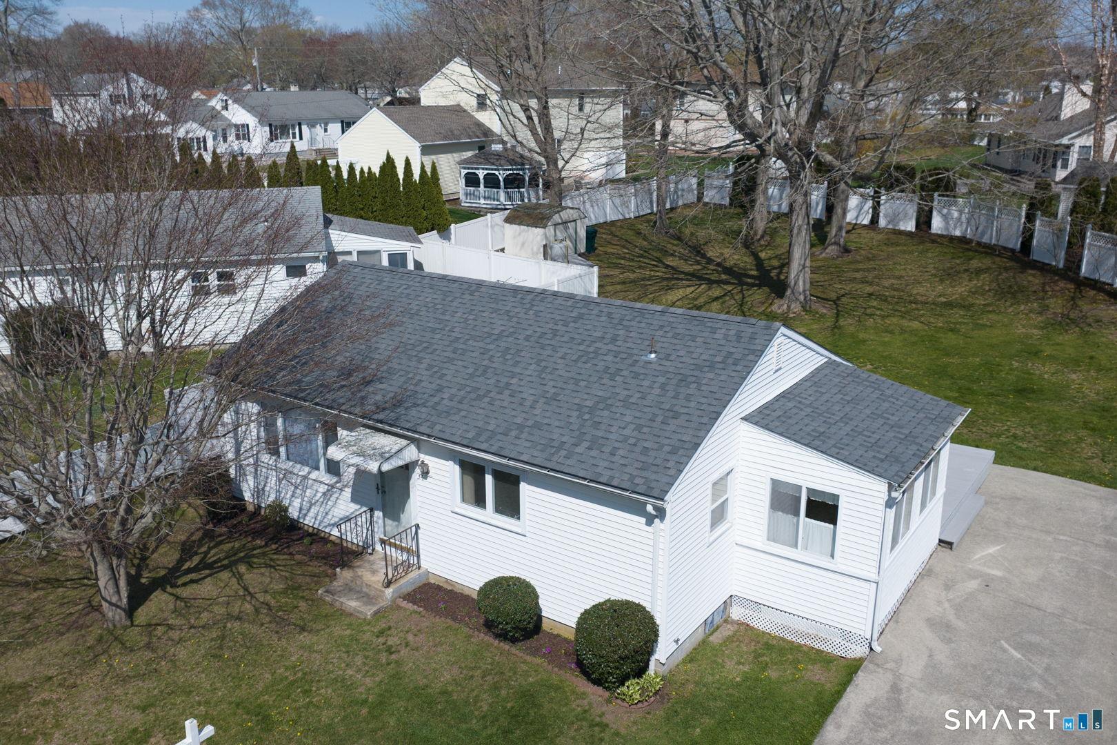 Image 4Aerial View: Private setting in the backyard with mature trees and shurbs
