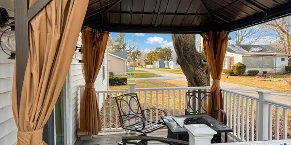 Image 4: Outdoor seating around a firepit