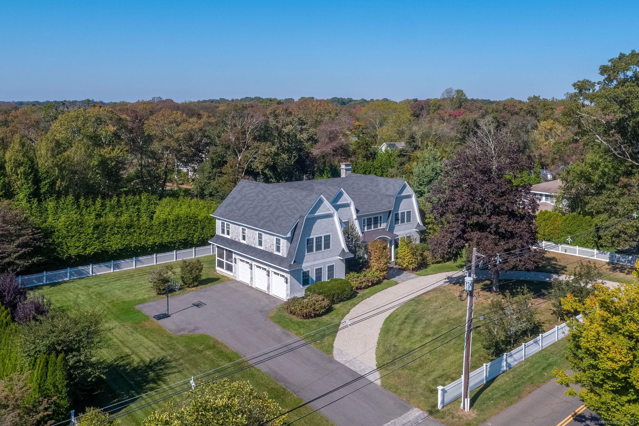 Image 1Front of House: Located on Island Avenue and within walking distance to everything Madison has to offer, sits this gorgeous custom built home on a large level 0.86 lot. This younger built home offers you HVAC efficiency, Anderson hurricane proof windows, plus more!