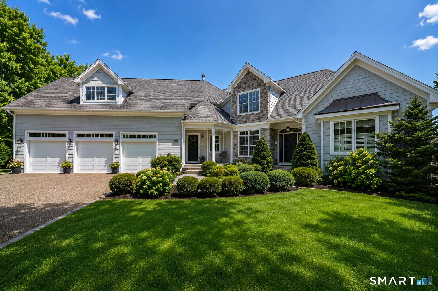 Image 1Front of House: An exceptional waterfront estate offering breathtaking water views from every room and a seamless connection to the surrounding shoreline.