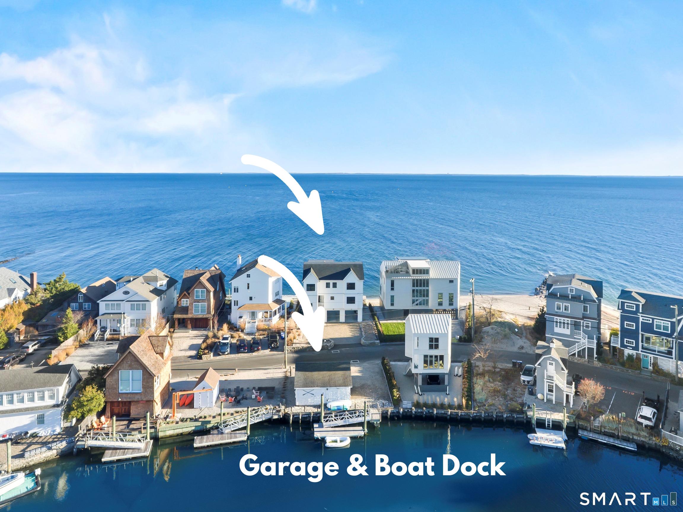 Image 4: Beach front AND creek with your own boat dock and additional two car garage. Approved option to build new garage available.