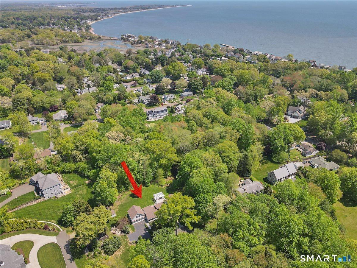 Image 2Aerial View: Aerial photo shows proximity to the water. A short 1/2 mile takes you to East Wharf beach and to the center of town.