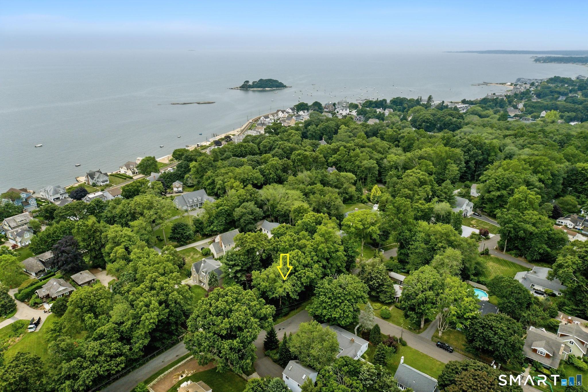 Image 2Aerial View: This home is located in a little piece of enchanted woods giving you tons of privacy yet you are close to everything.