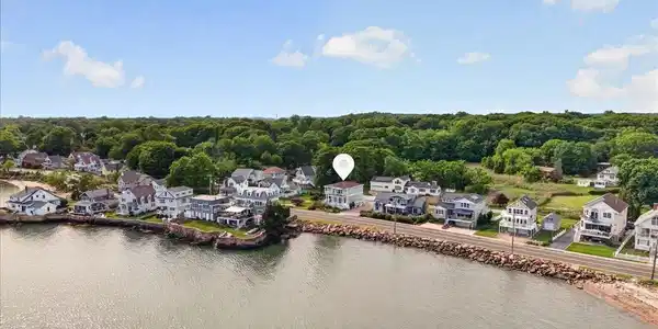 Image 2Aerial View: Located in the sidewalk lined Short Beach Community with deeded beach and spectacular views.