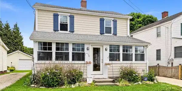 Image 2Front of House: Every charming detail has been meticuously selected; like the custom -made wooden shutters that add the perfect nautical touch to the front of the house.