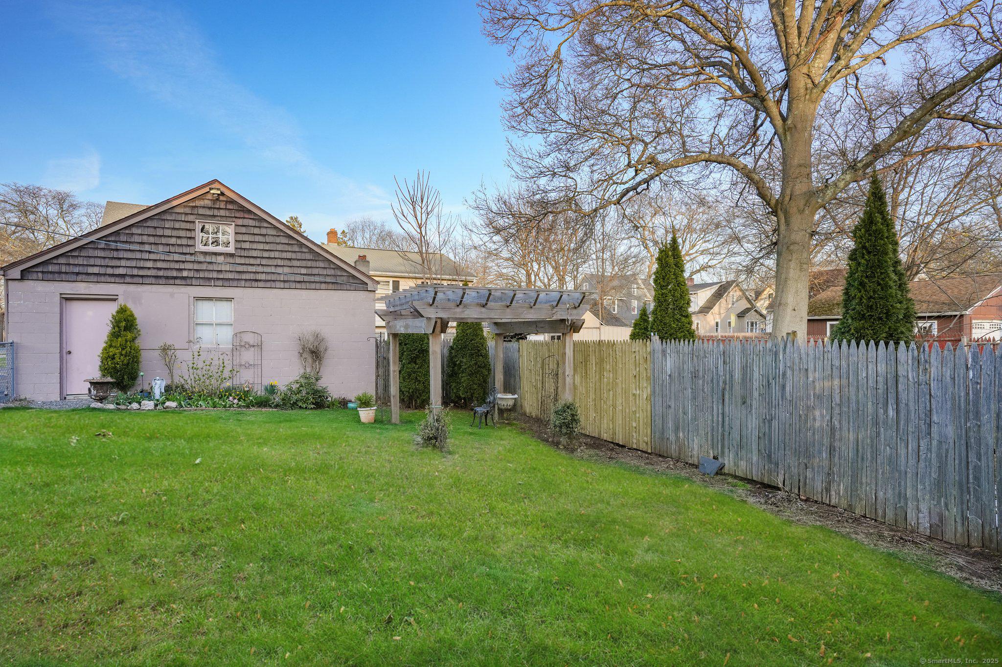 Image 3Yard: Private yard with NEWER Pergola! Two car garage, Deck!