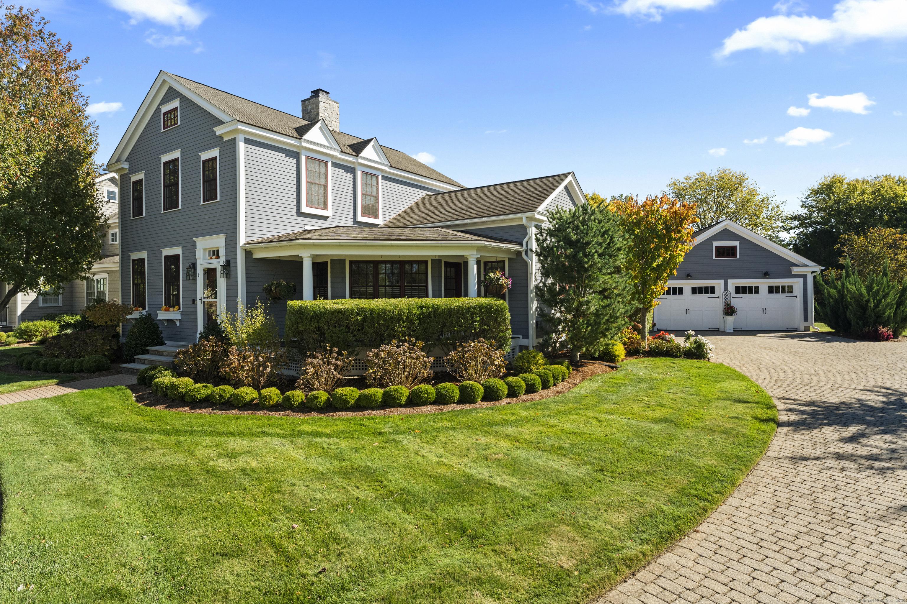 Image 3: Extensive hardscape and landscape accentuate grand front porch and large patio