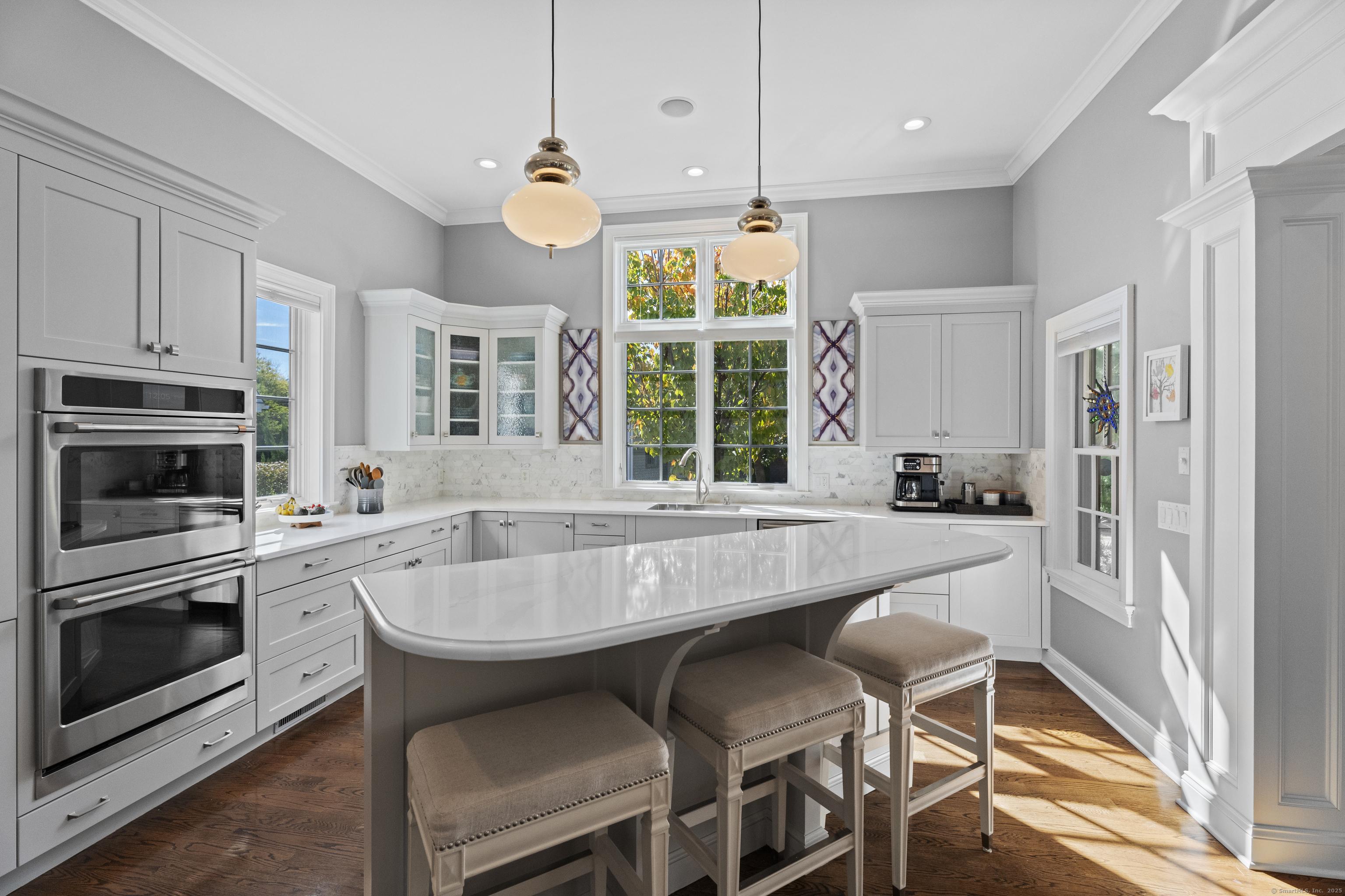 Image 4: Stunning updates start in the quartz kitchen