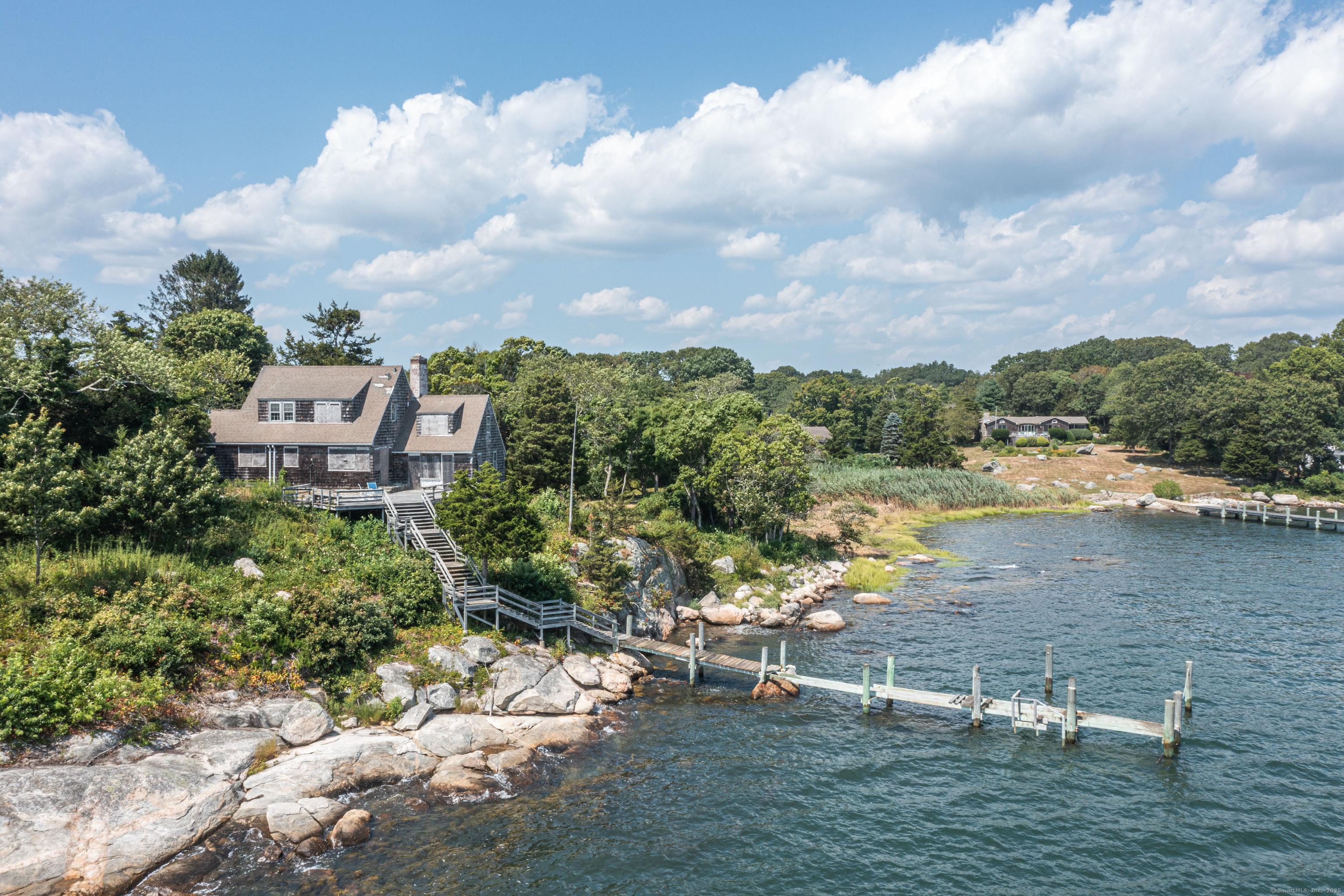 Image 1: Direct Waterfront with Unobstructed Water Views. 1.24 Acres with 201' of Water front on Fishers Island Sound.