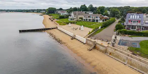 Image 4: Direct access at the end of Webster Point Rd with steps down to a beach