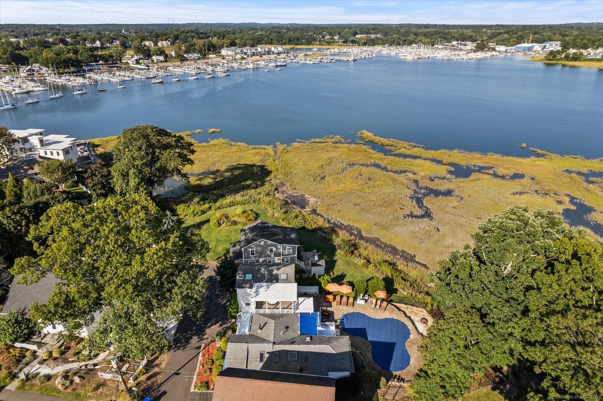 Image 1Aerial View: Gorgeous and captivating water views surround this home