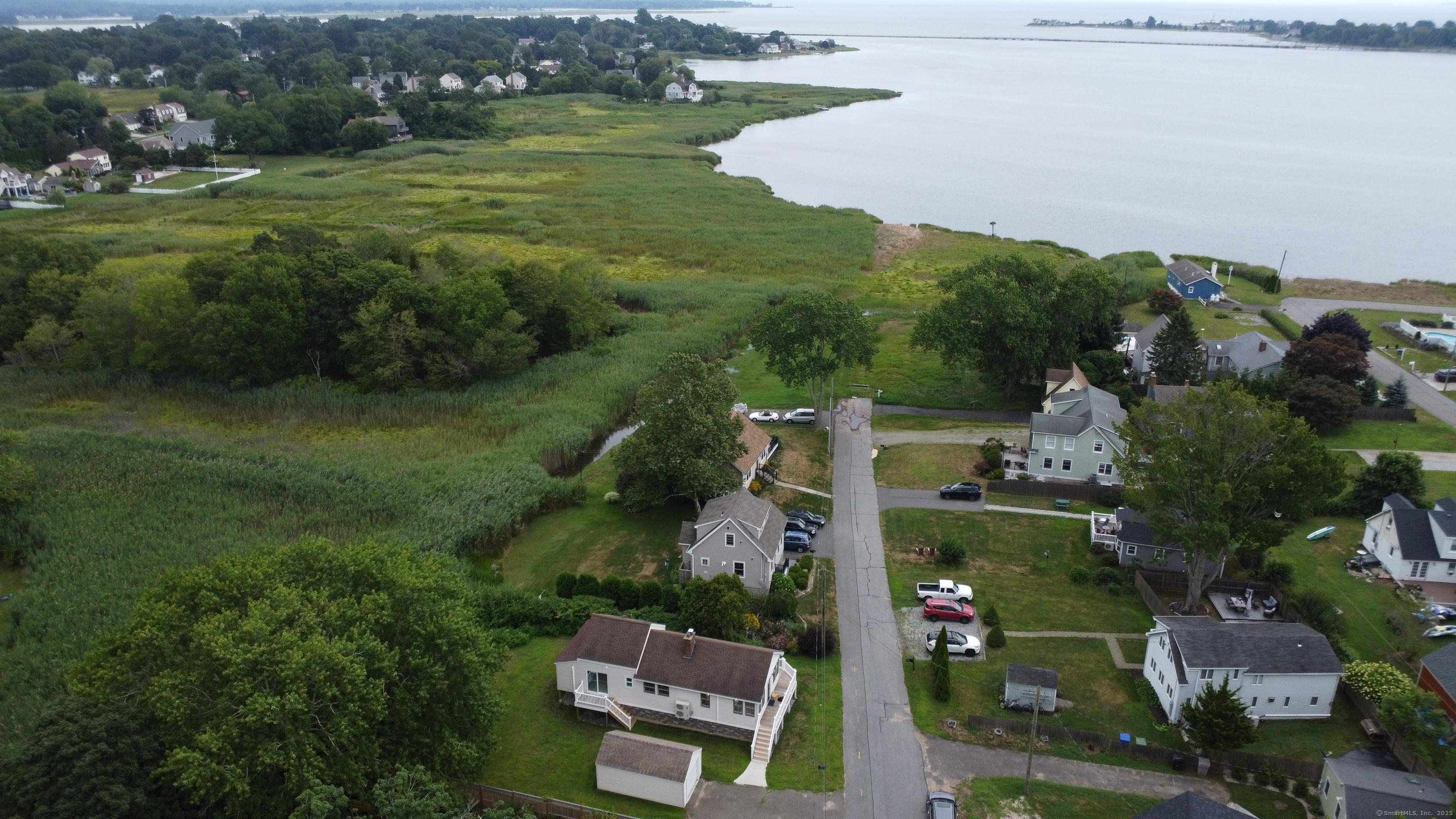 Image 4Aerial View: South cove with house in foreground