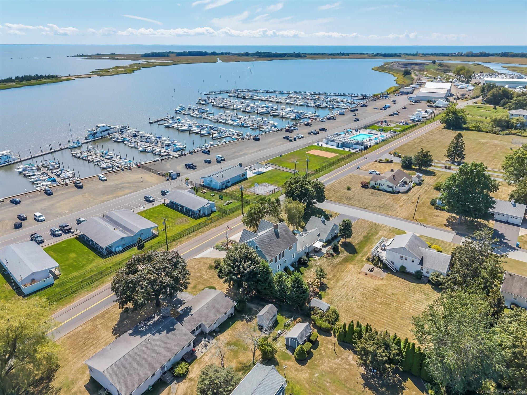 Image 2Aerial View: Situated just across the street from Cedar Island Marina-offering stunning water views and unbeatable access to boating and seaside living.