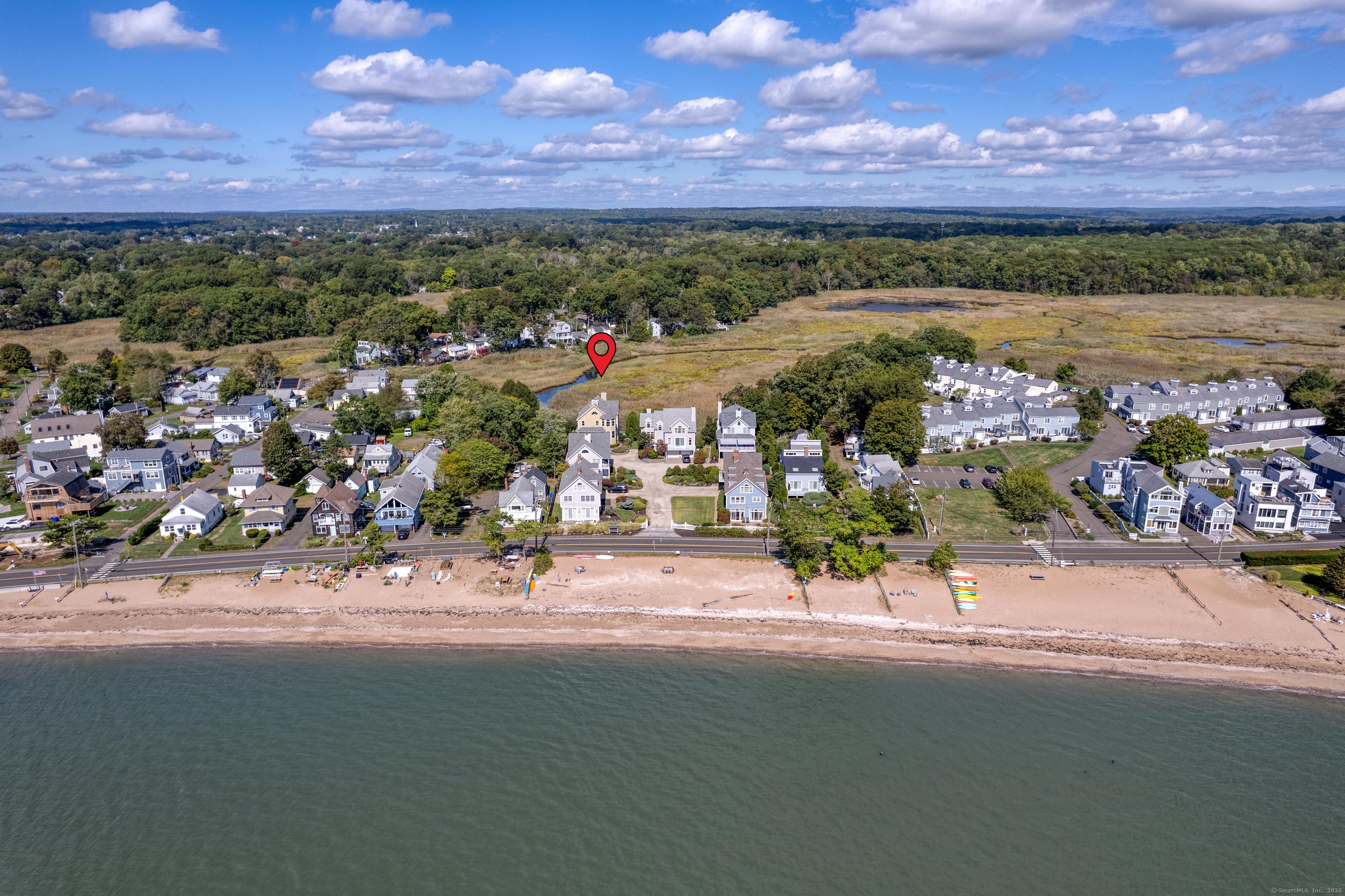 Image 1: Private beach, sweeping marsh views and easy living are waiting for you at 76 Limewood Ave!