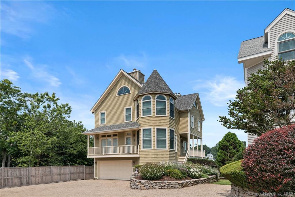 Image 2: Three floors of living, 2 car garage and expansive decking.