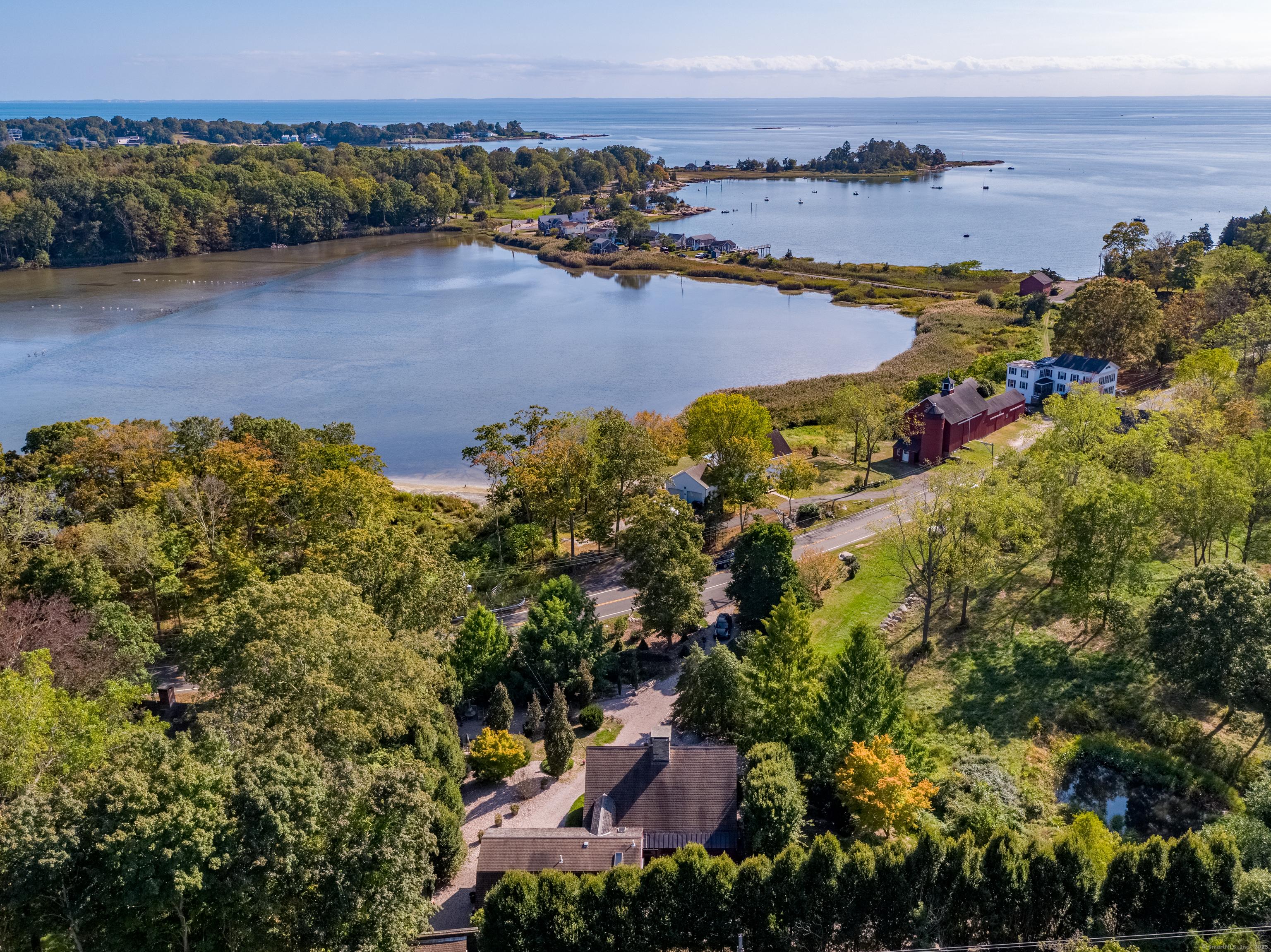 Image 1Aerial View: Shell Beach Lagoon on left leading into the Long Island Sound. Home is located directly across Leetes Island Road.