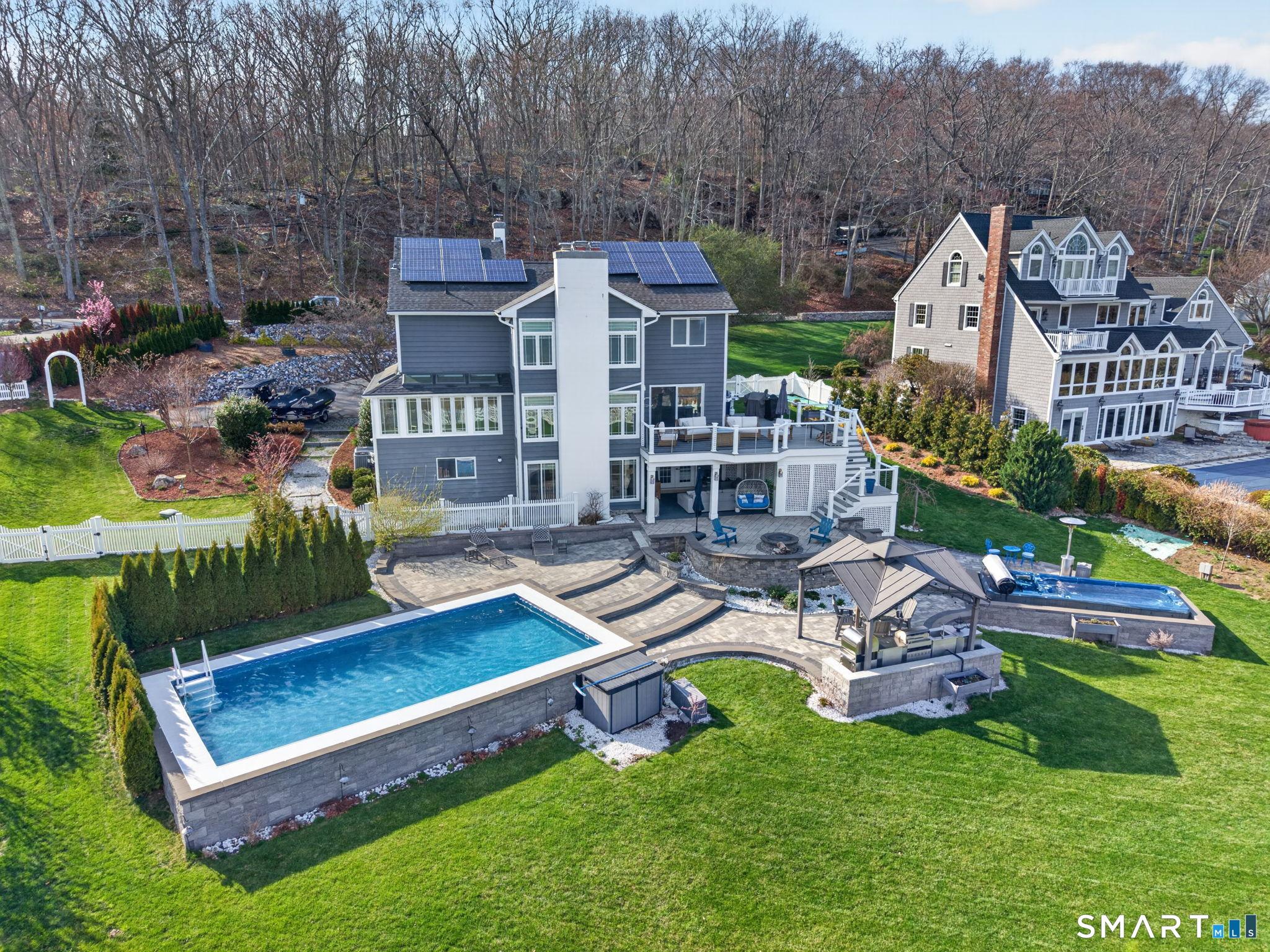 Image 2: Direct Waterfront. Resort Living at it's finest. 4 Bedrooms with 4 Full Baths. Lower Level Suite with walk-out to patio. Plans for approved dock included.