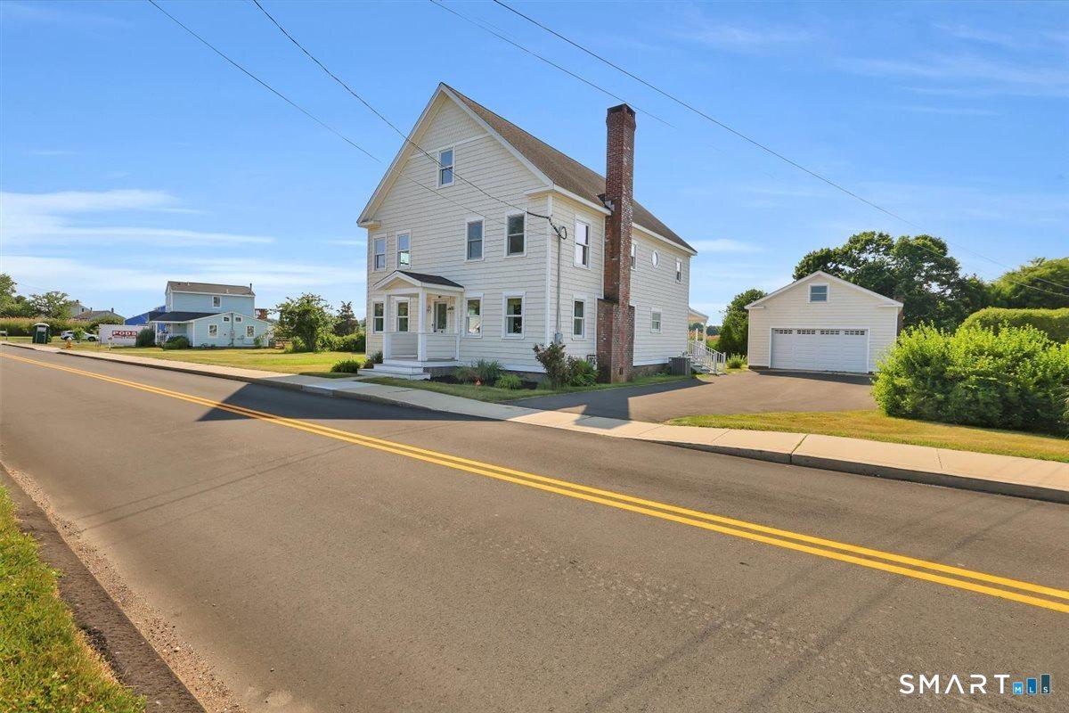 Image 2Front of House: Remodeled circa 1874 home offering 3 bedrooms, 3 full baths, and a detached 2-car garage. Blends historic charm with modern updates throughout.